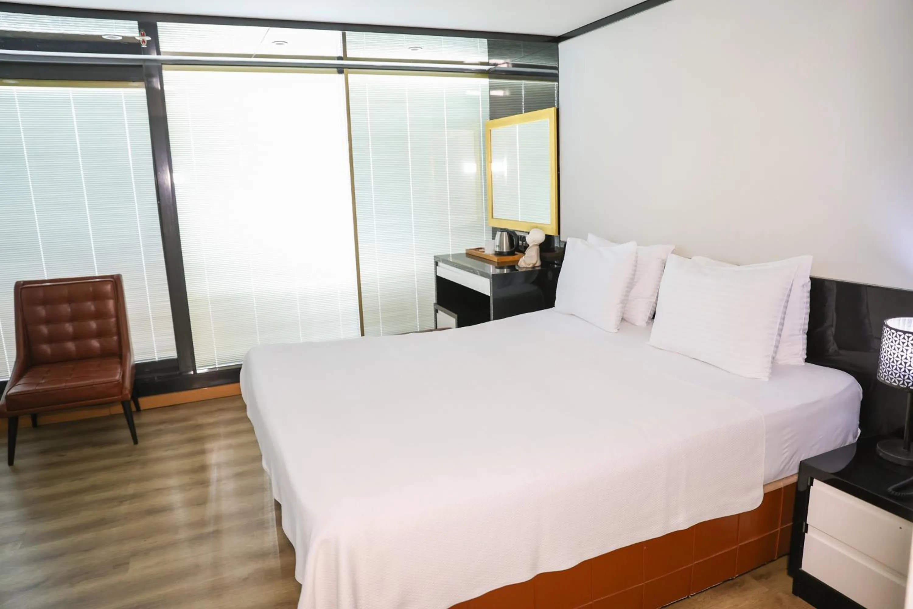 Bed in The Hera Platinum Hotel