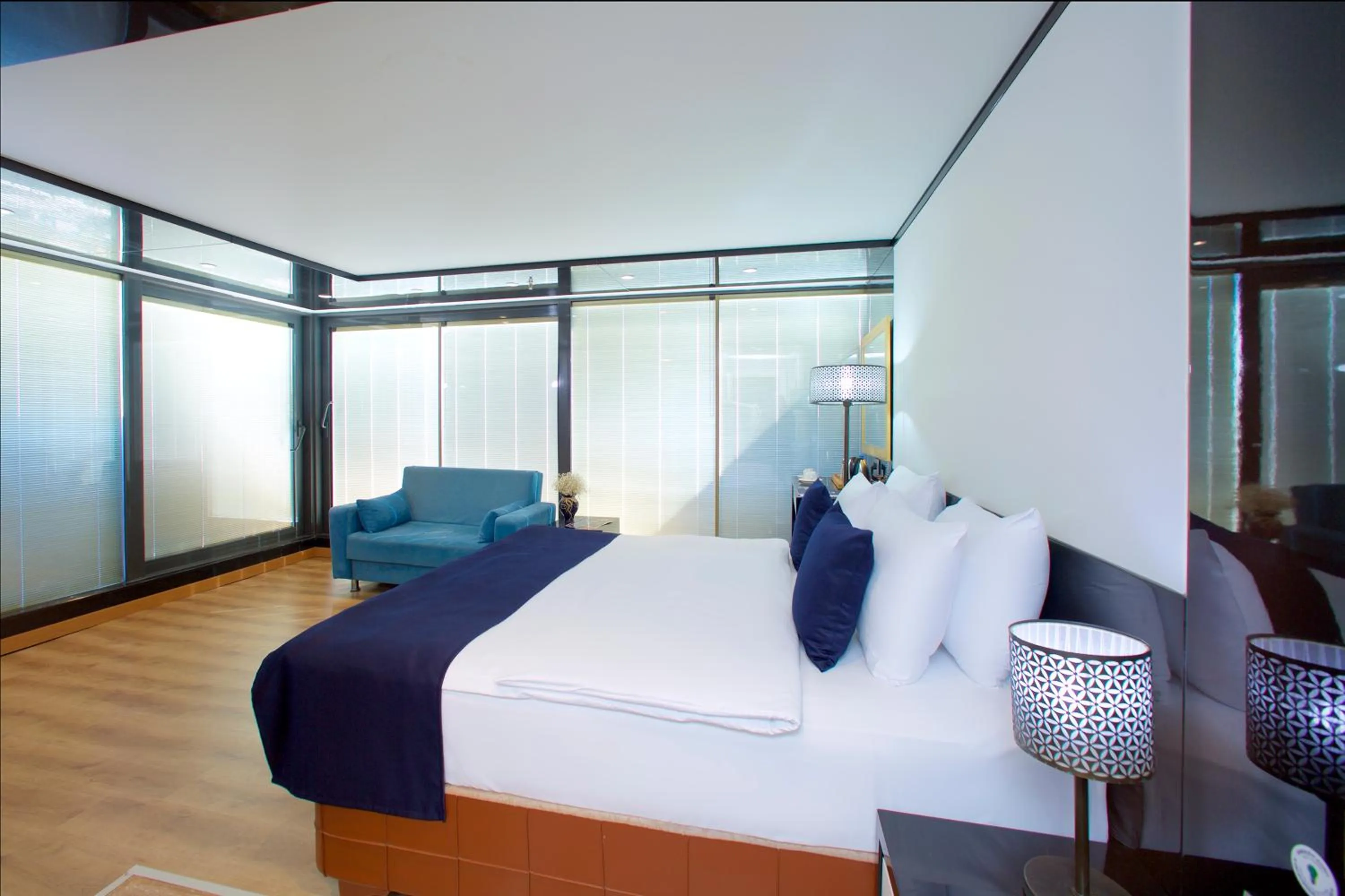 Bed in The Hera Platinum Hotel