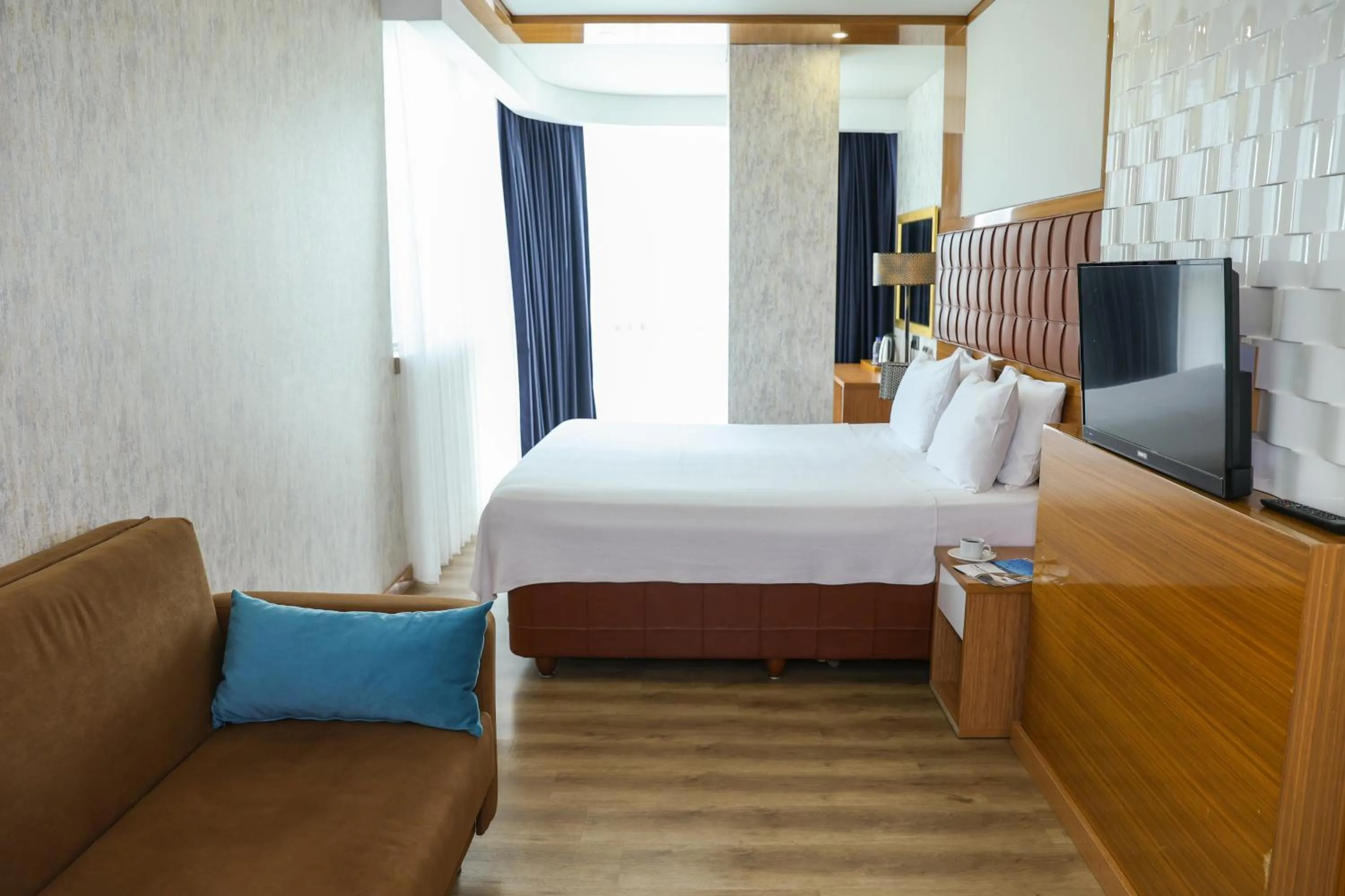 Bed in The Hera Platinum Hotel