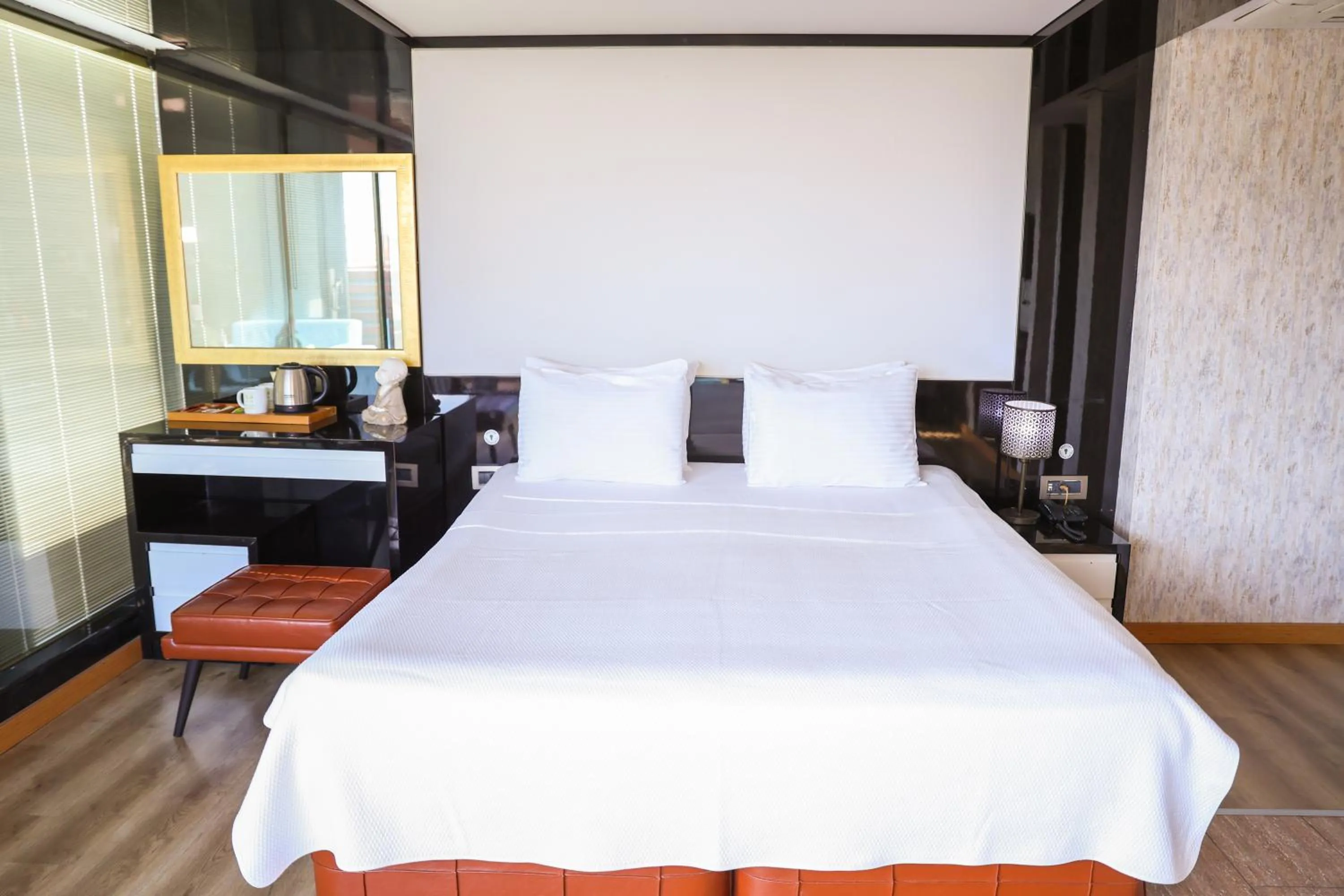 Bed in The Hera Platinum Hotel