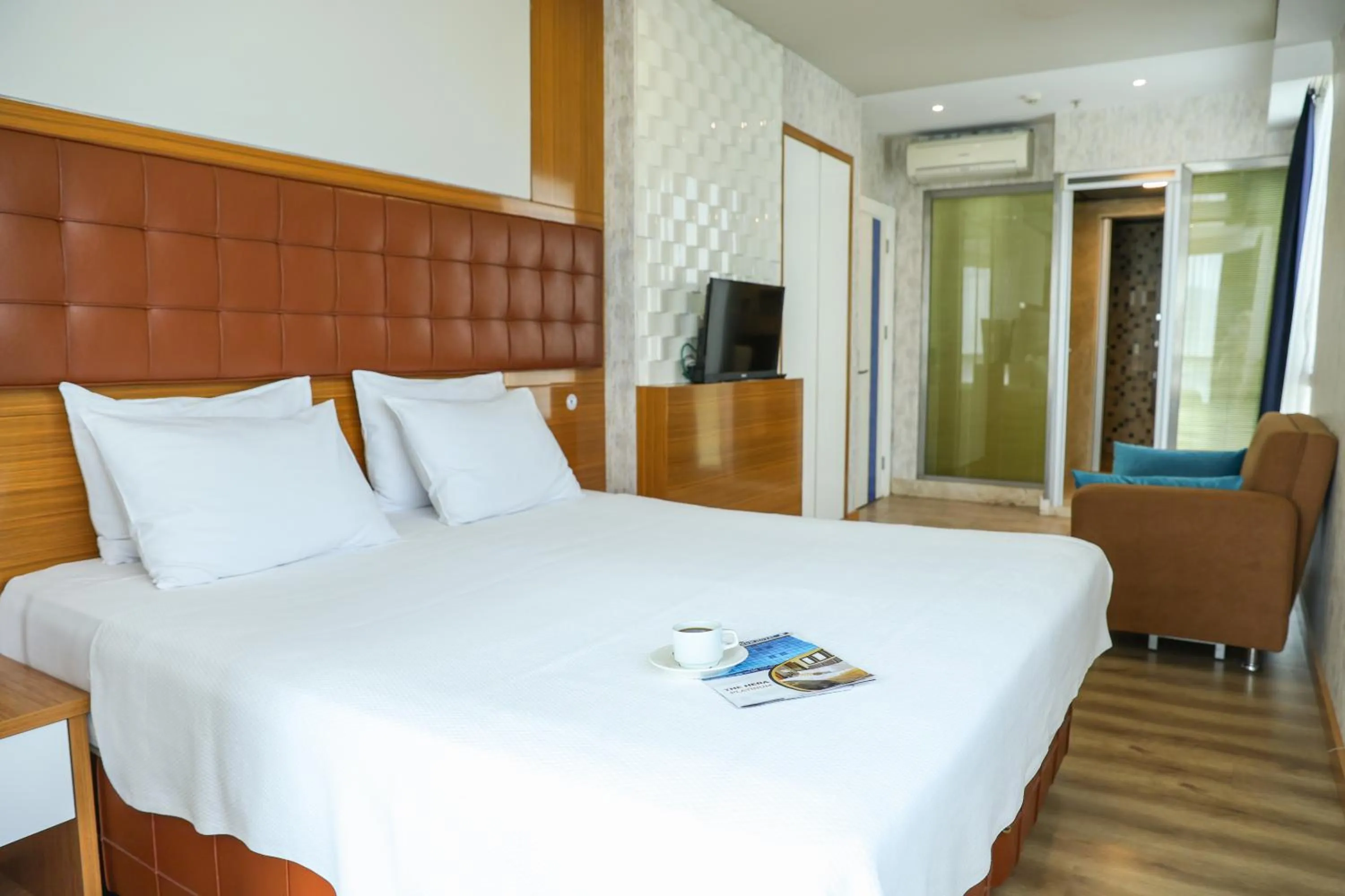 Bed in The Hera Platinum Hotel