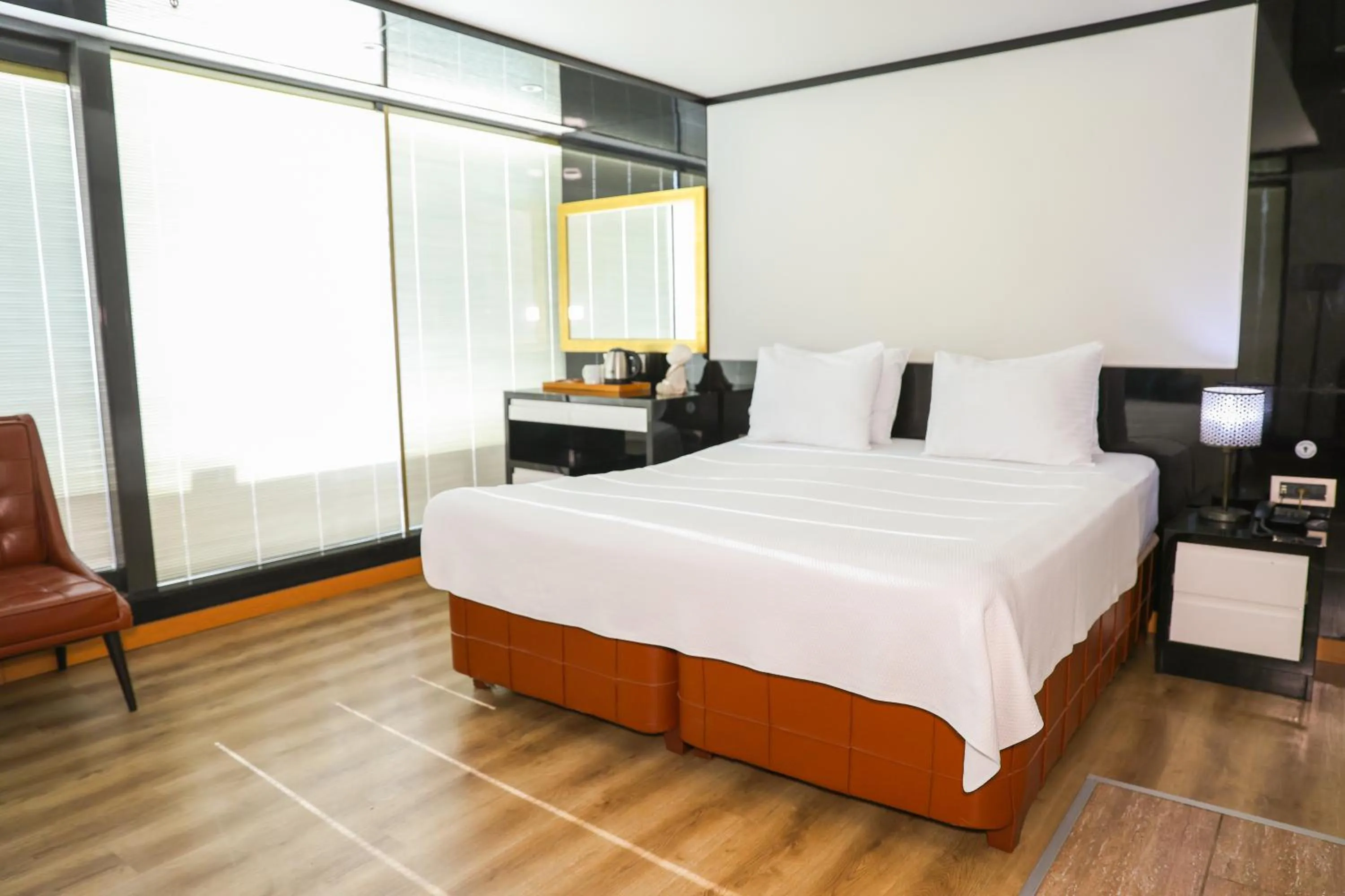 Bed in The Hera Platinum Hotel