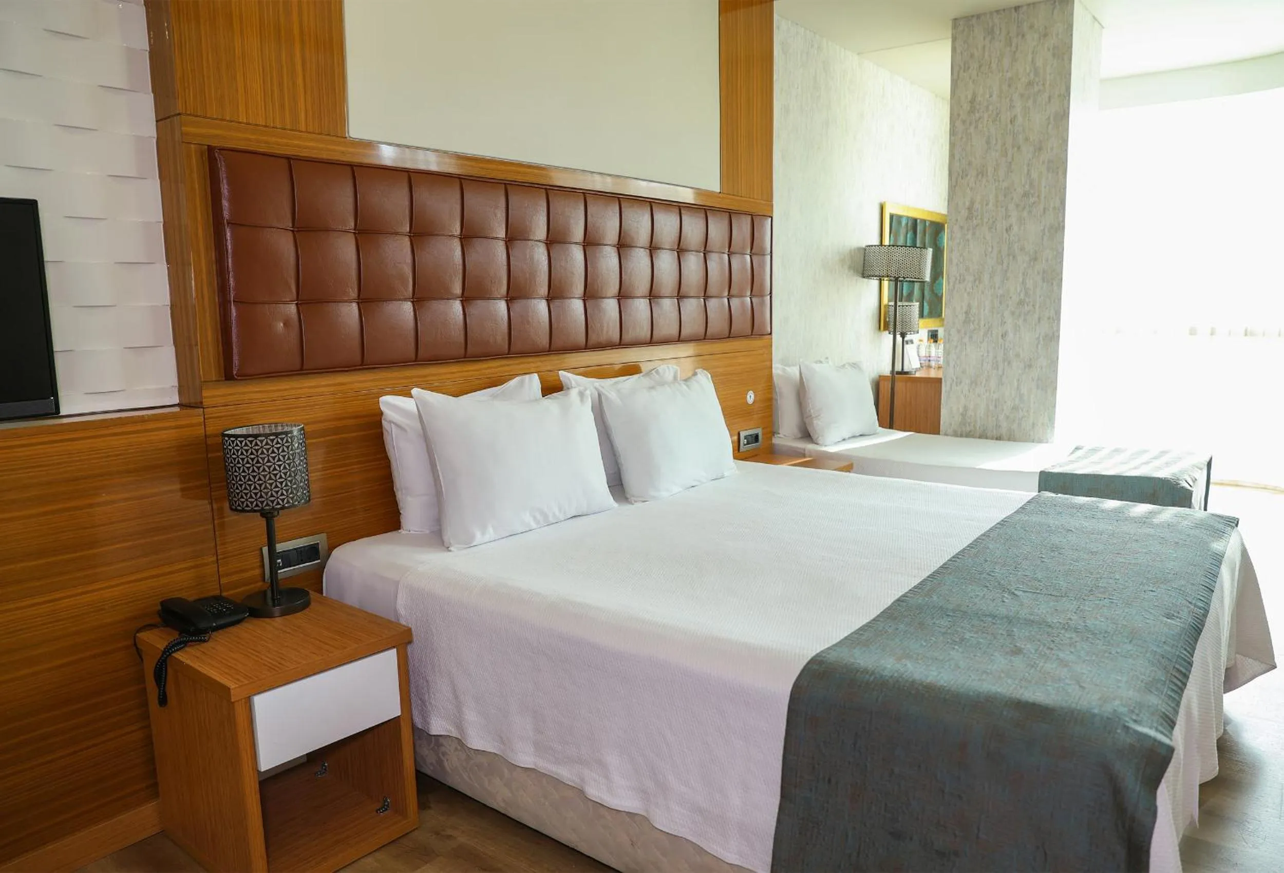 Bed in The Hera Platinum Hotel