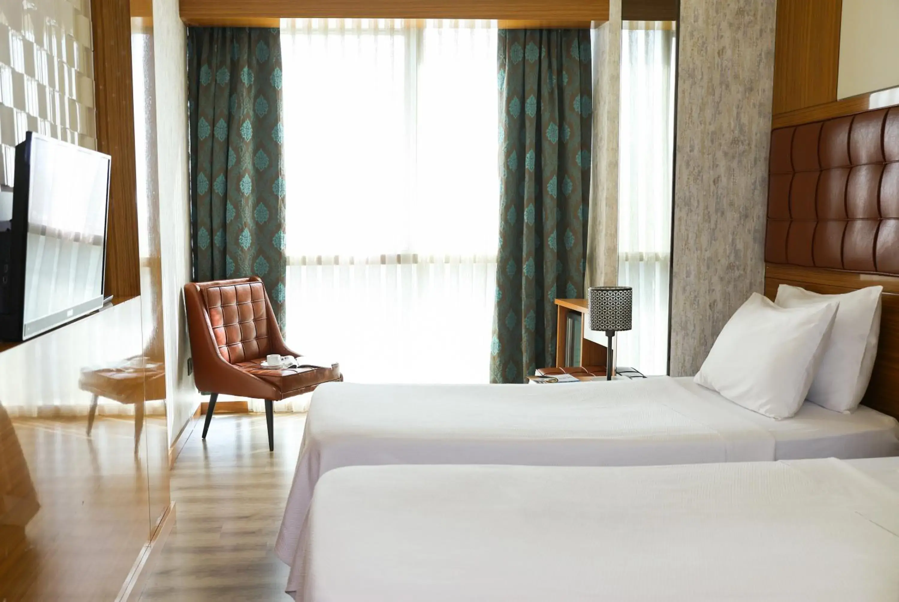 Bed in The Hera Platinum Hotel Bed in The Hera Platinum Hotel