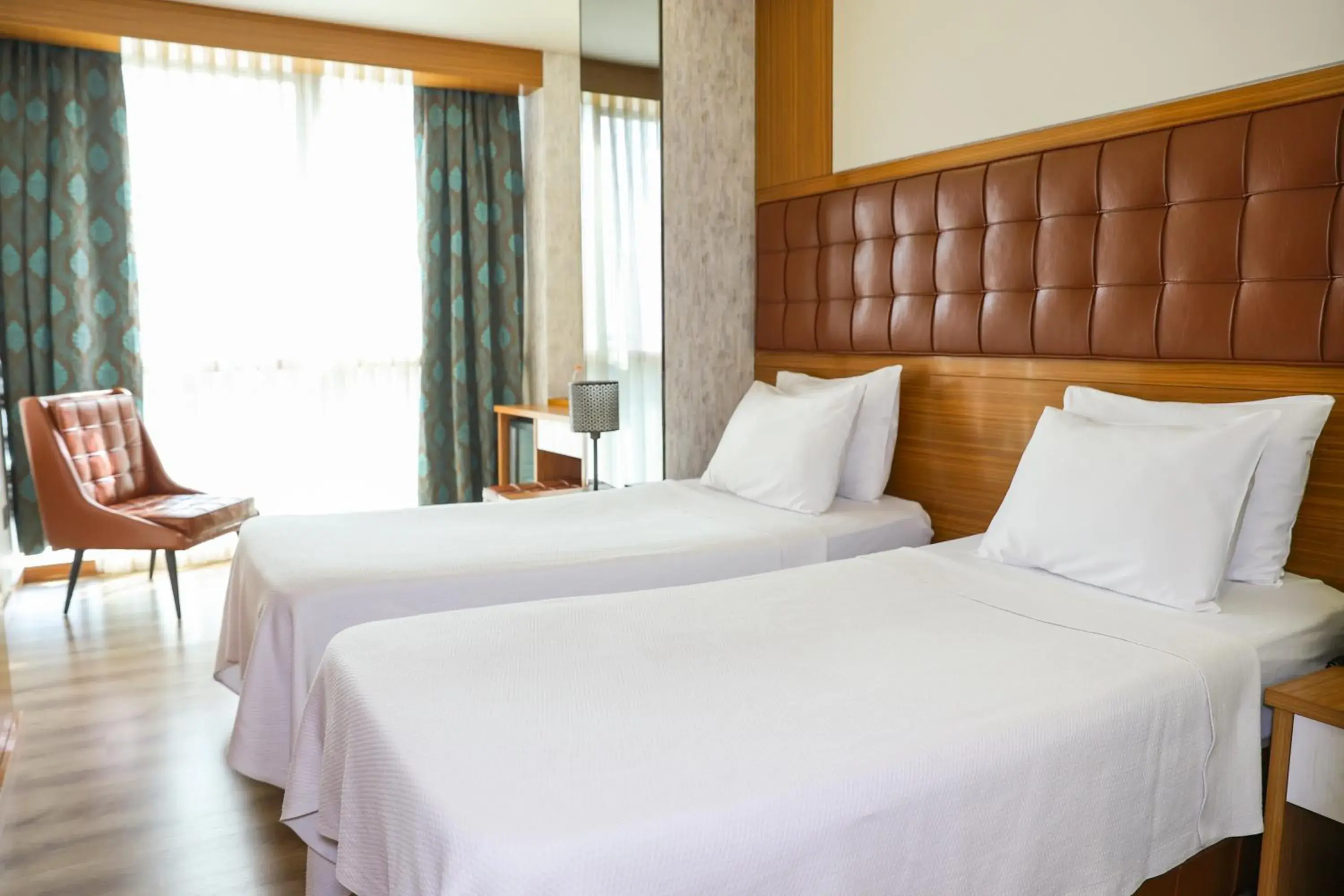 Bed in The Hera Platinum Hotel Bed in The Hera Platinum Hotel