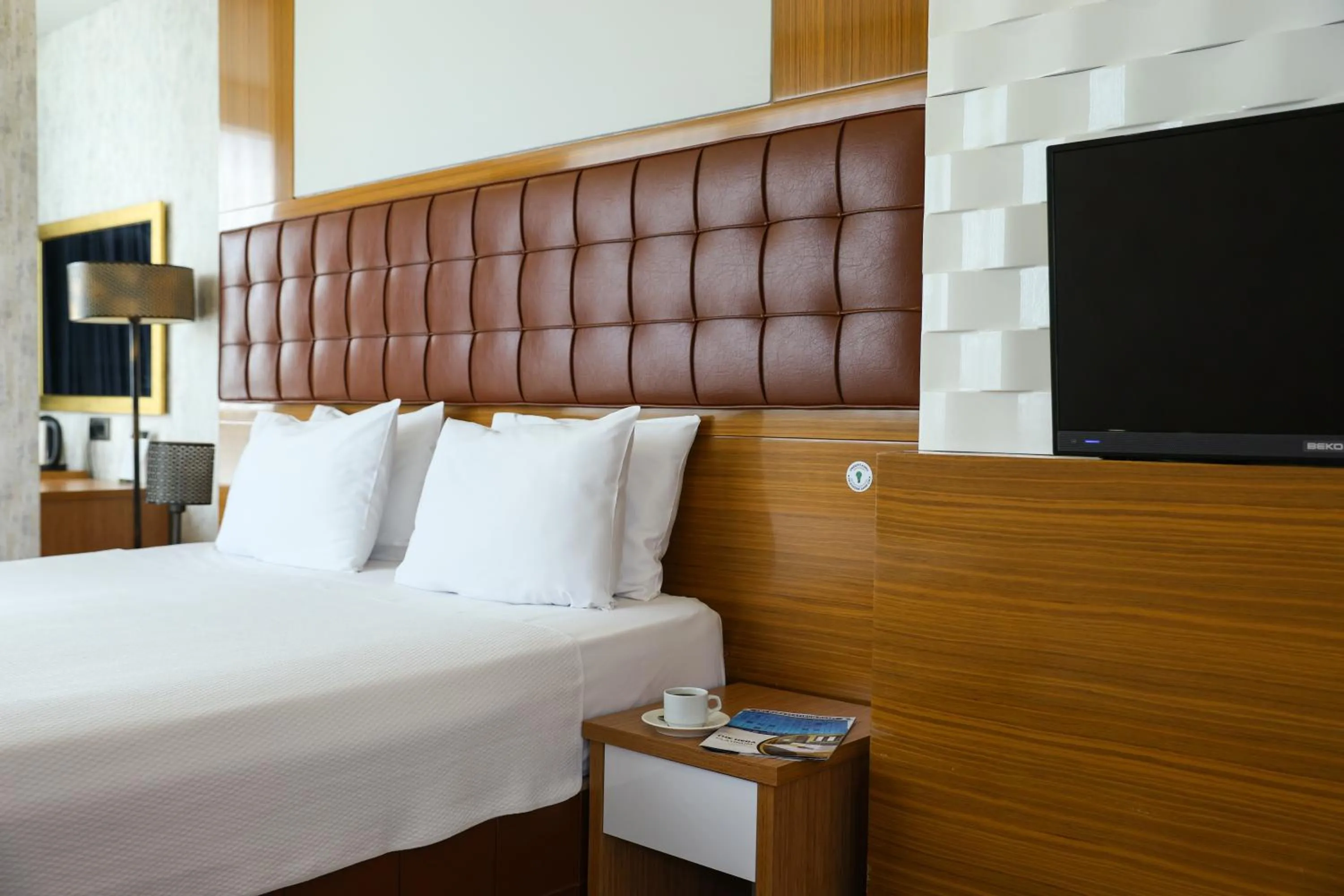 Bed in The Hera Platinum Hotel
