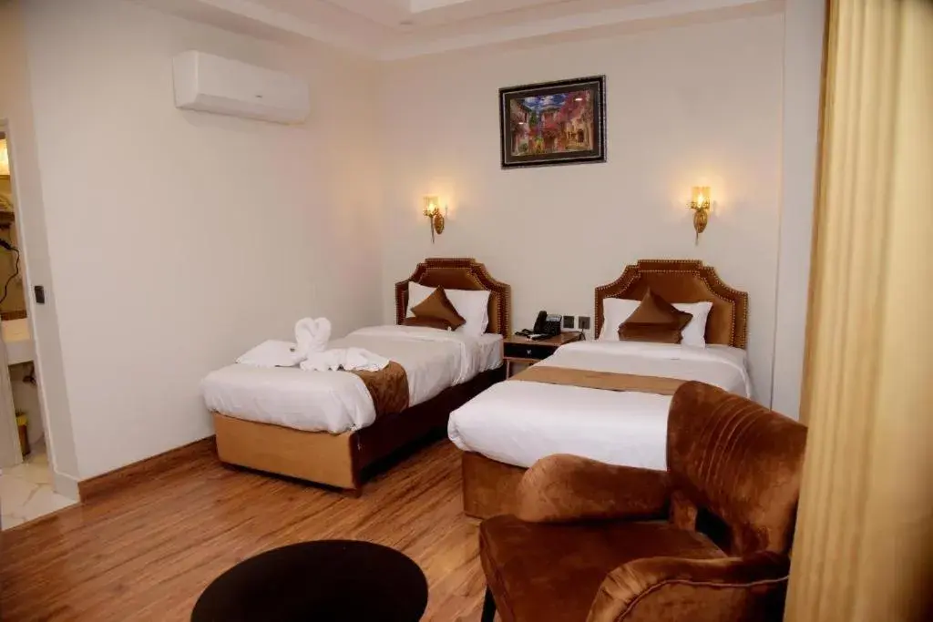Bedroom, Bed in The Rich Hotel & Apartments Bedroom, Bed in The Rich Hotel & Apartments