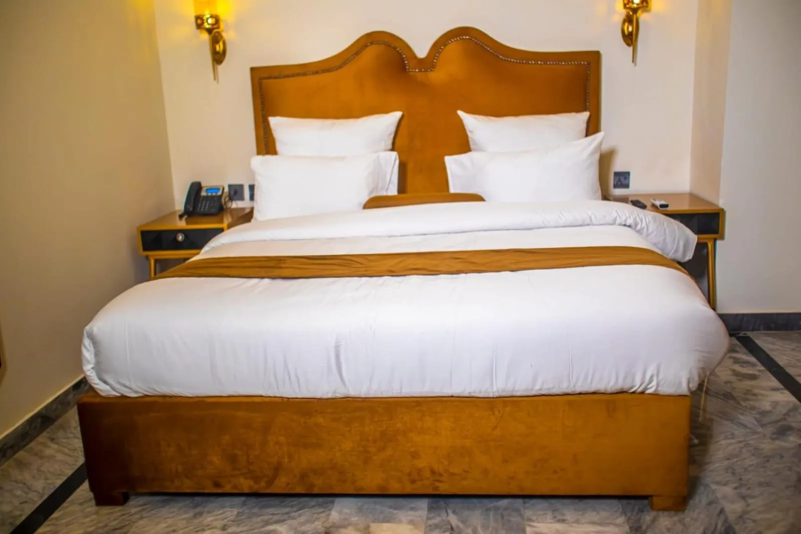 Bed in The Rich Hotel & Apartments