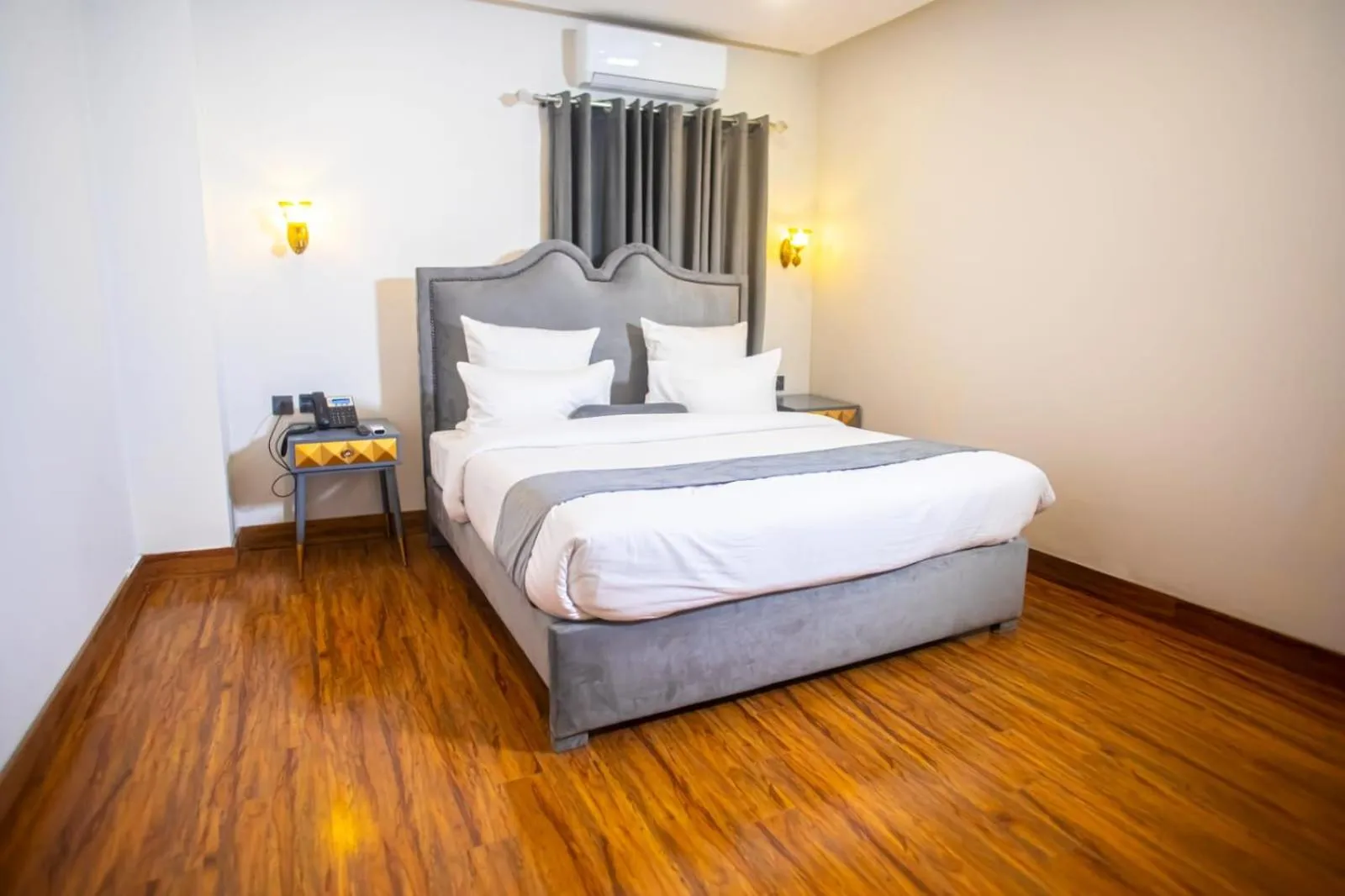 Bed in The Rich Hotel & Apartments