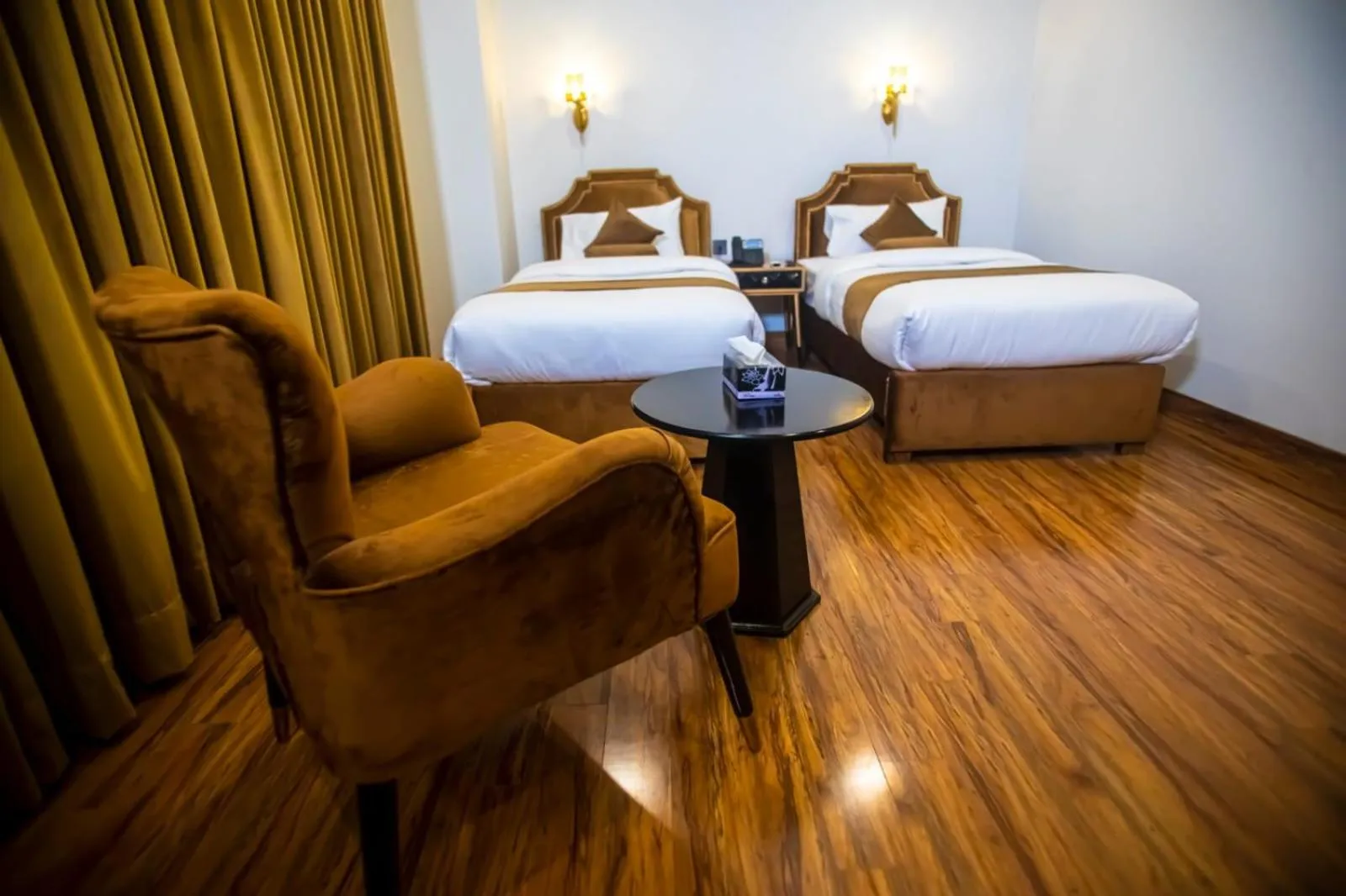 Bed in The Rich Hotel & Apartments