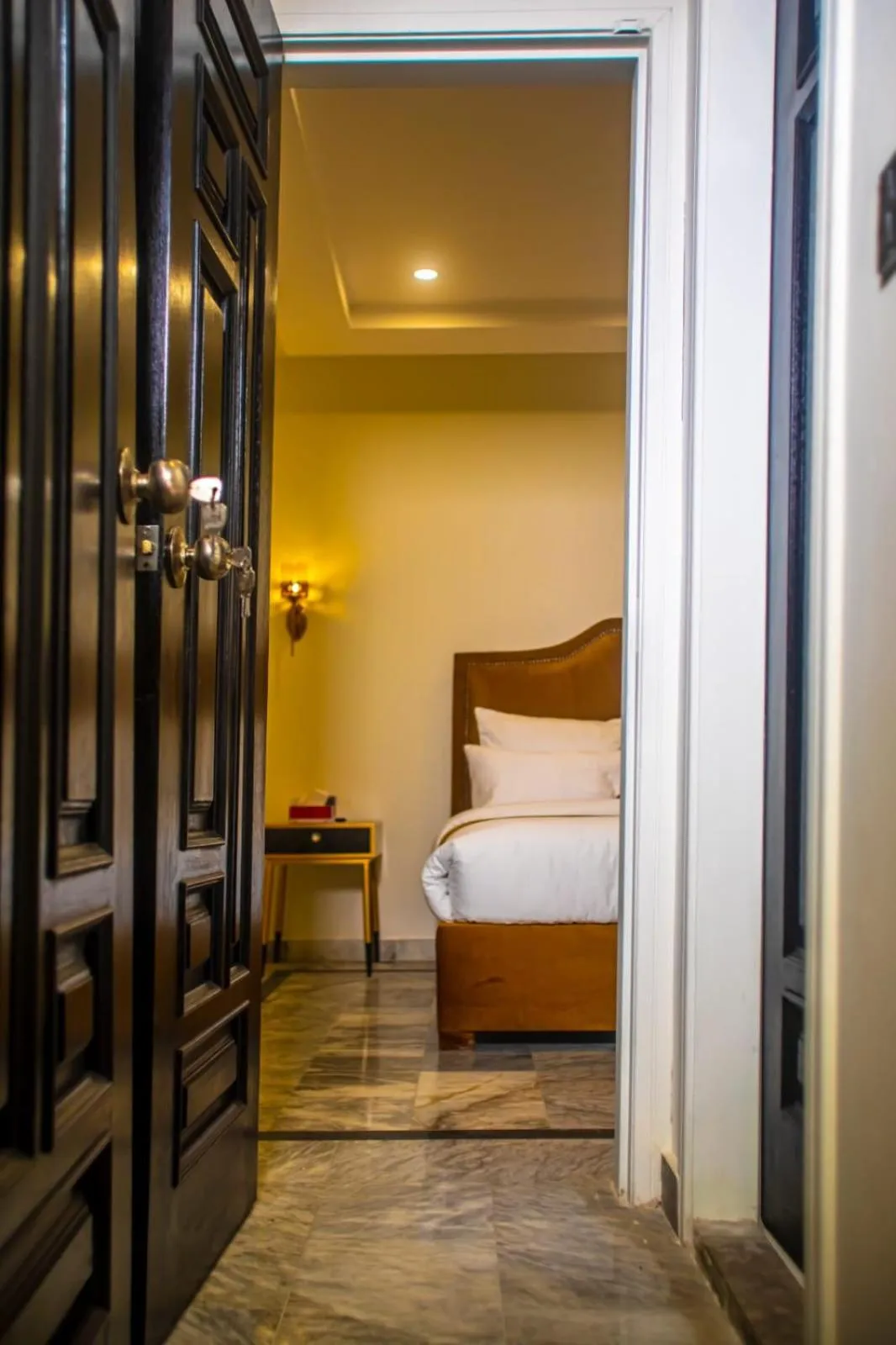 Bed in The Rich Hotel & Apartments