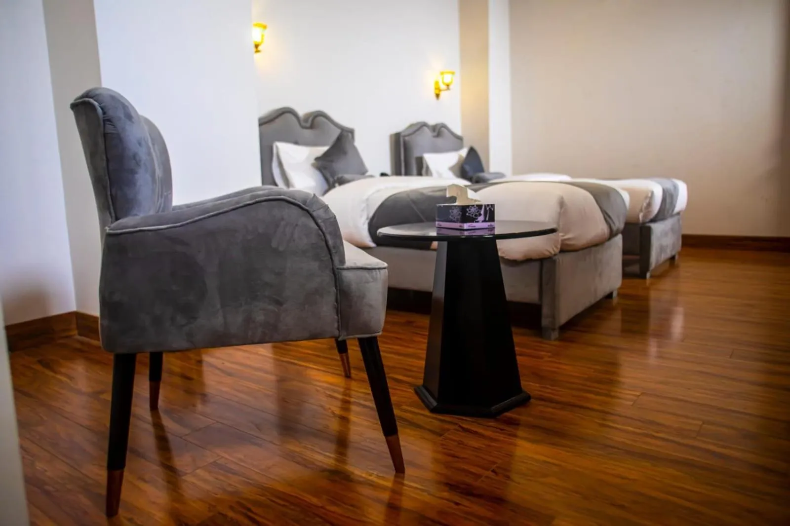 Bed in The Rich Hotel & Apartments