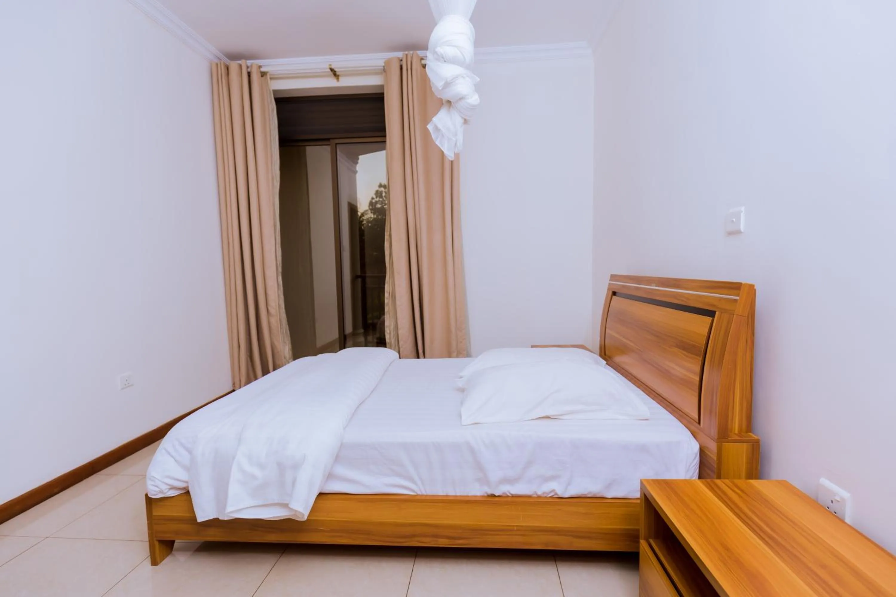 Bed in KAMI LUXURY APARTMENTS