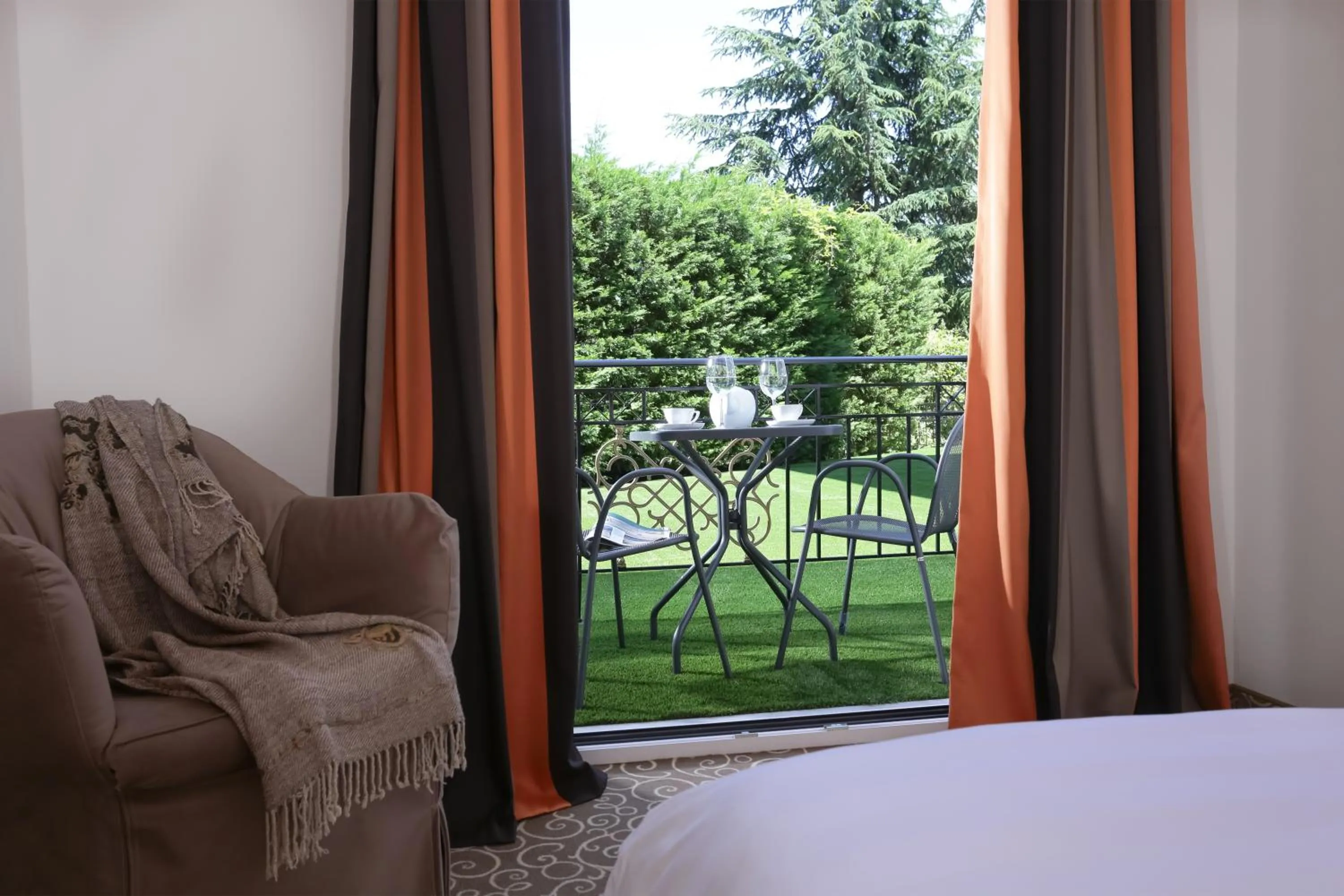 Garden view, Bed in Chloe Luxury Hotel