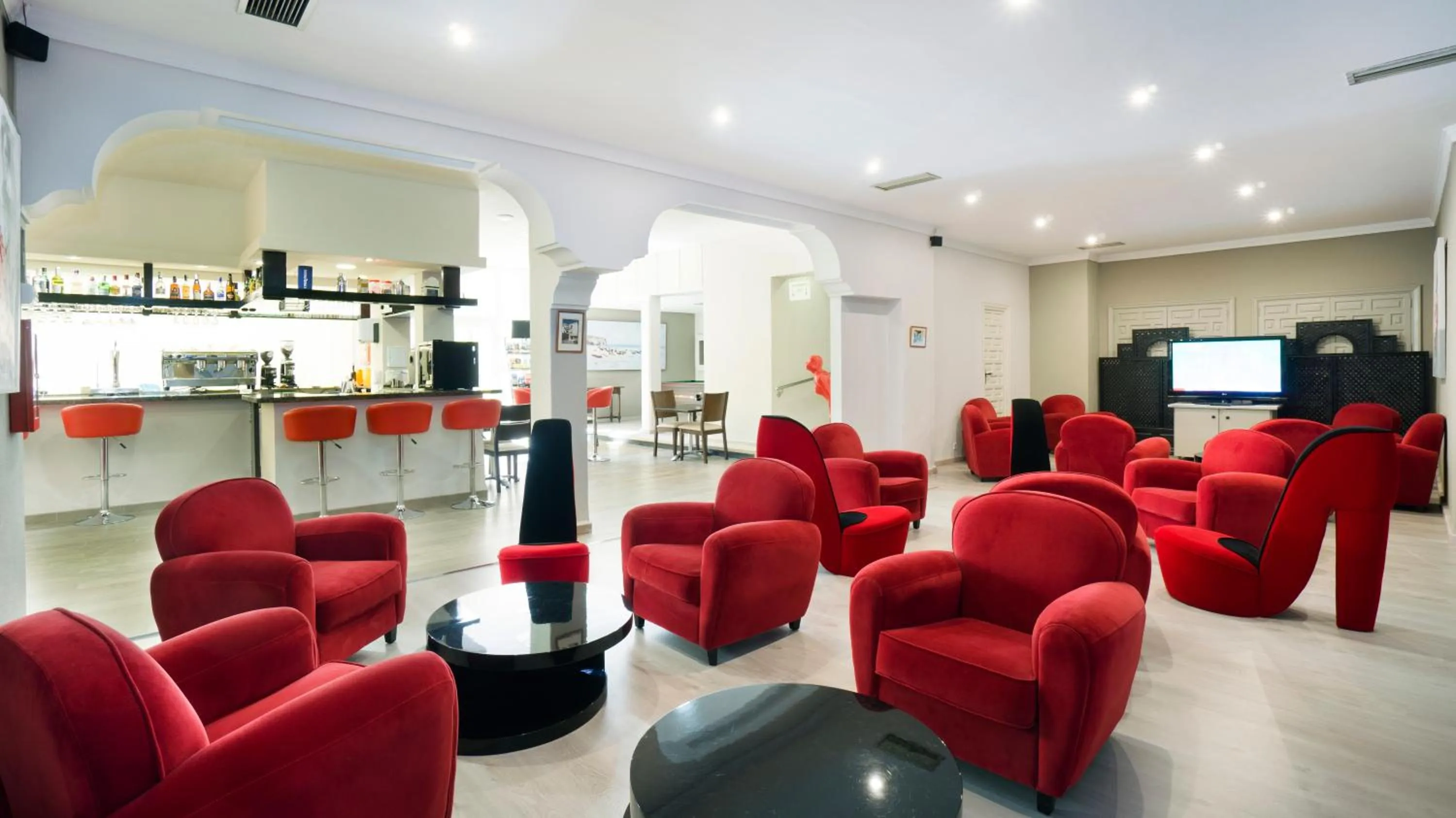 Communal lounge/ TV room in Hotel El Pozo