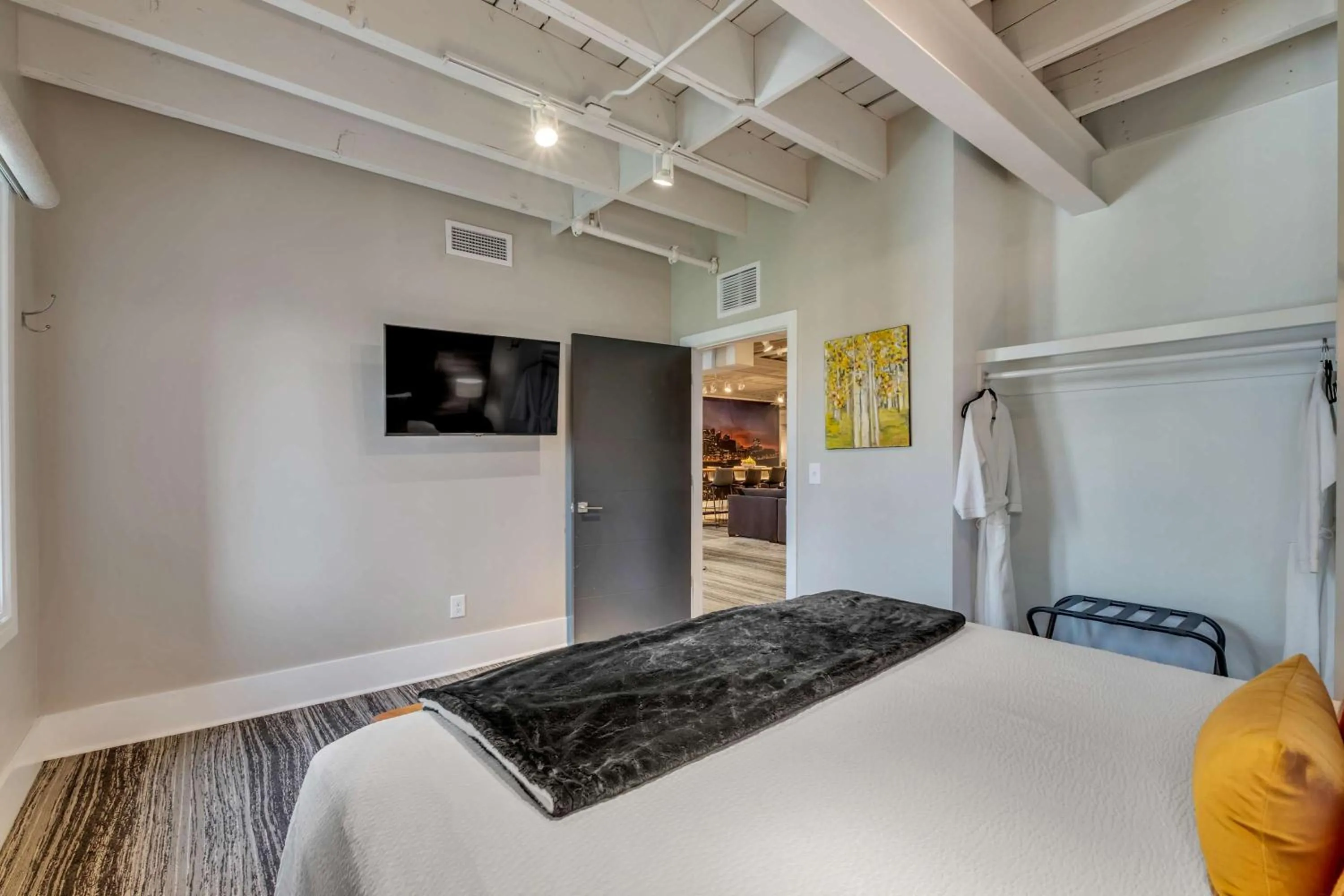 Bed in Skyline Suite with Penthouse & Rooftop Deck 6BR by Maddox Hotel
