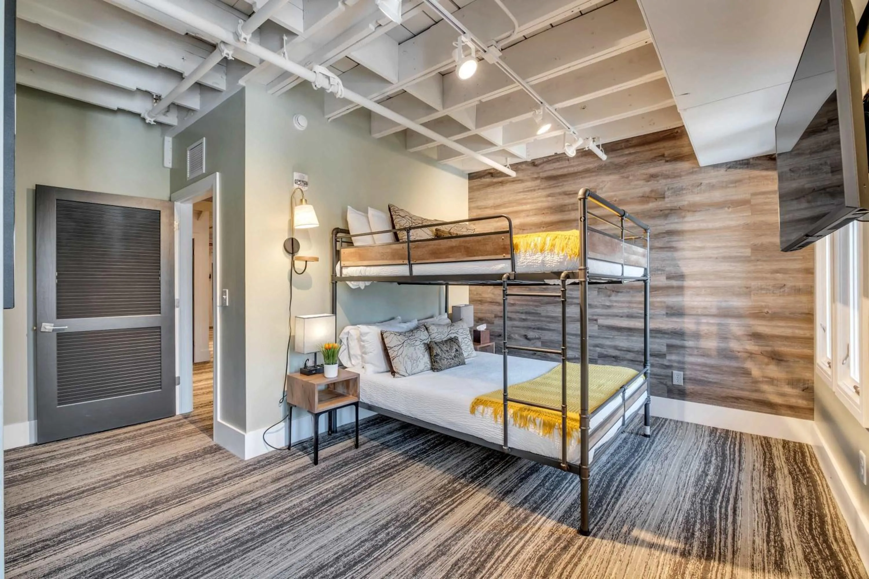 Bed in Skyline Suite with Penthouse & Rooftop Deck 6BR by Maddox Hotel