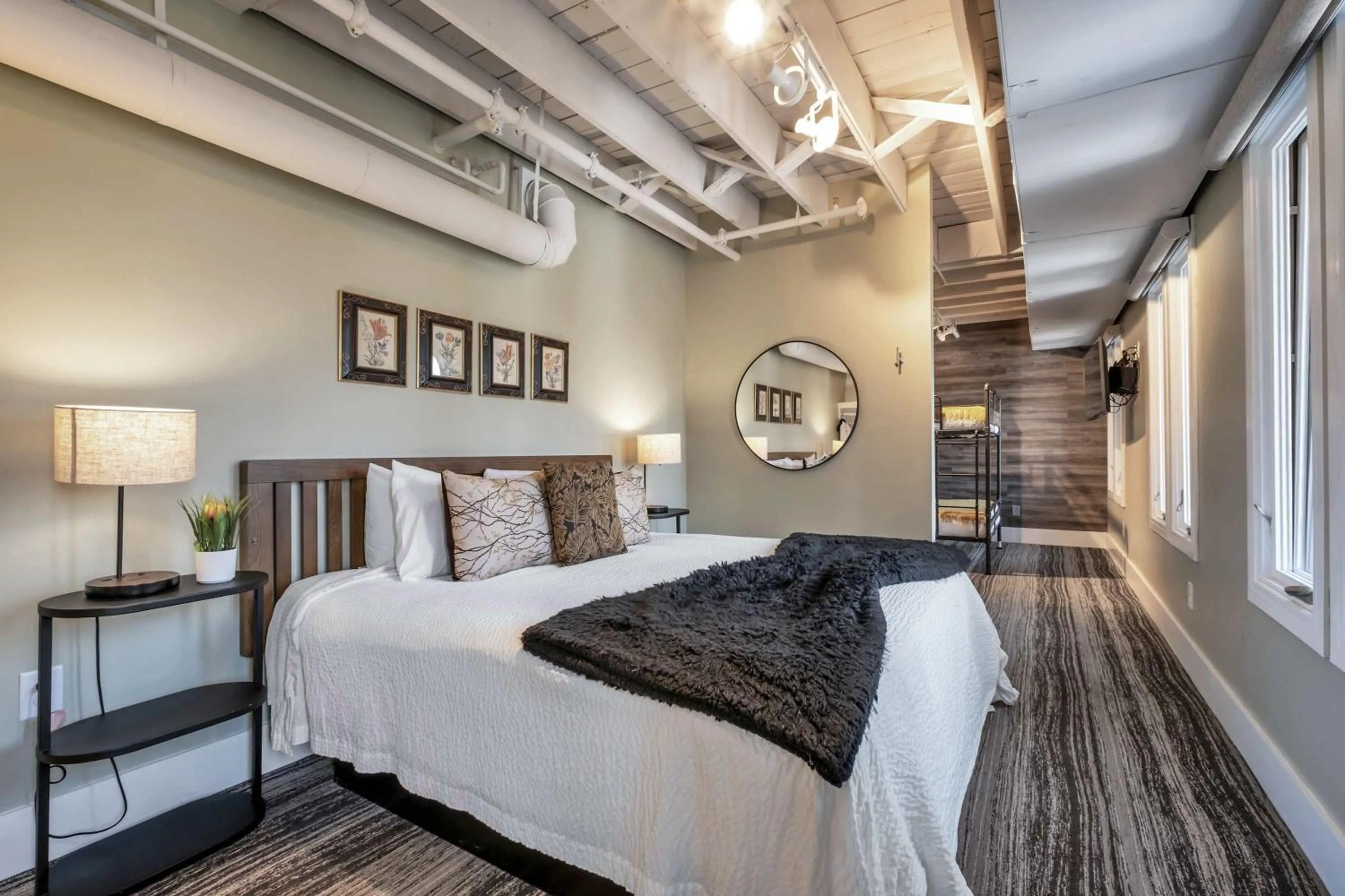 Bed in Skyline Suite with Penthouse & Rooftop Deck 6BR by Maddox Hotel