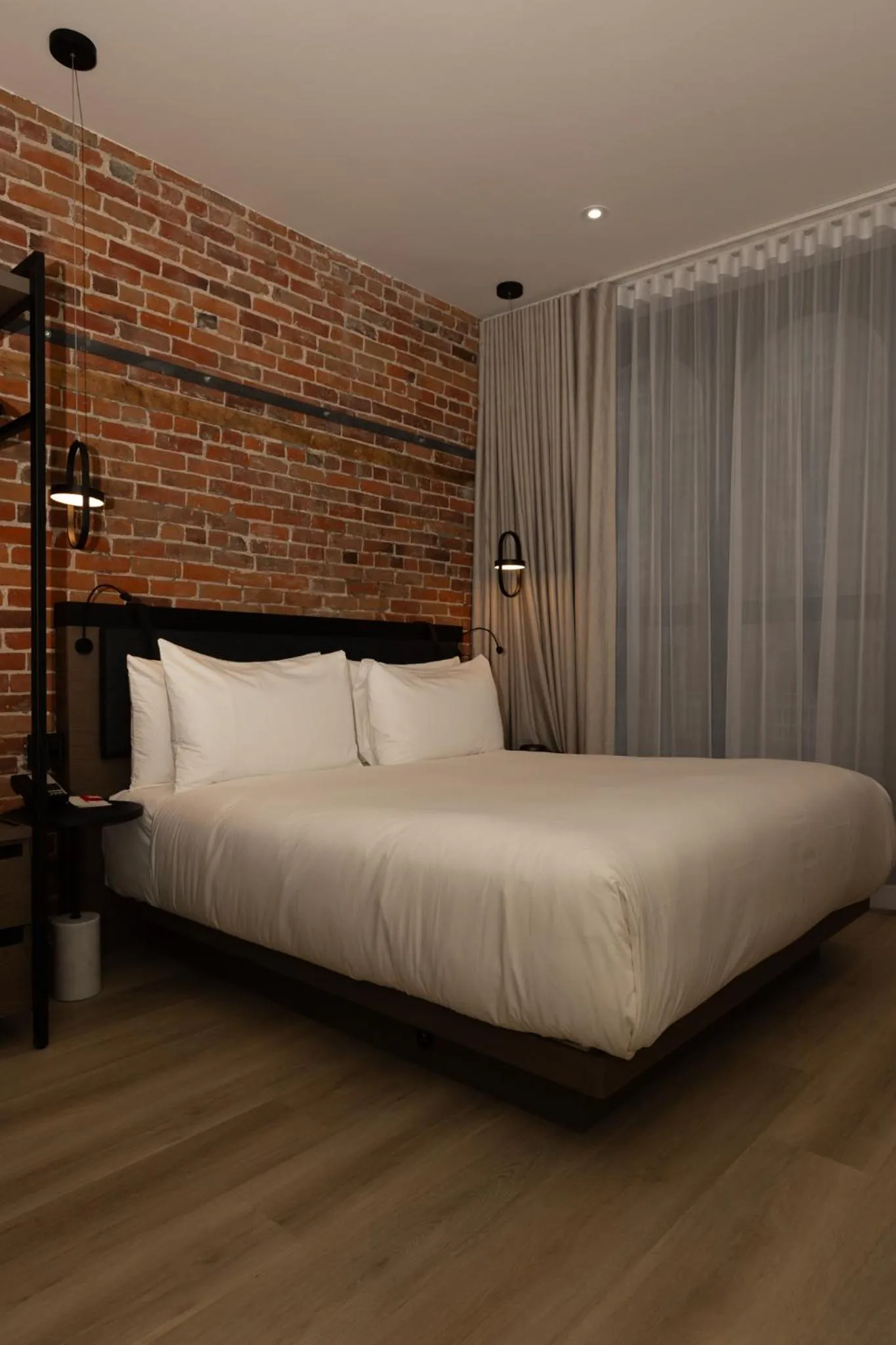 Bed in Le Petit Hotel Notre Dame