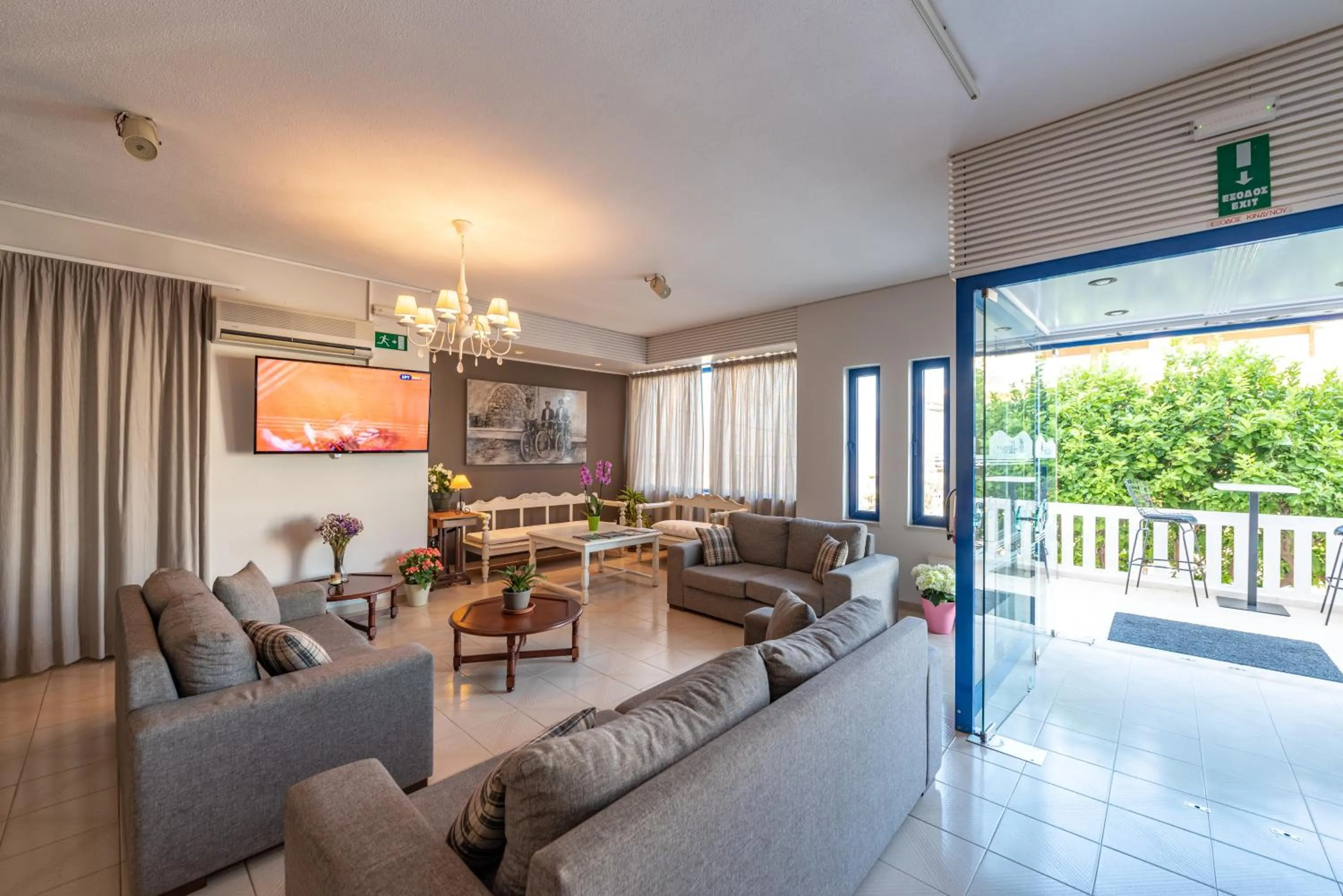 Communal lounge/ TV room in Alexis Hotel