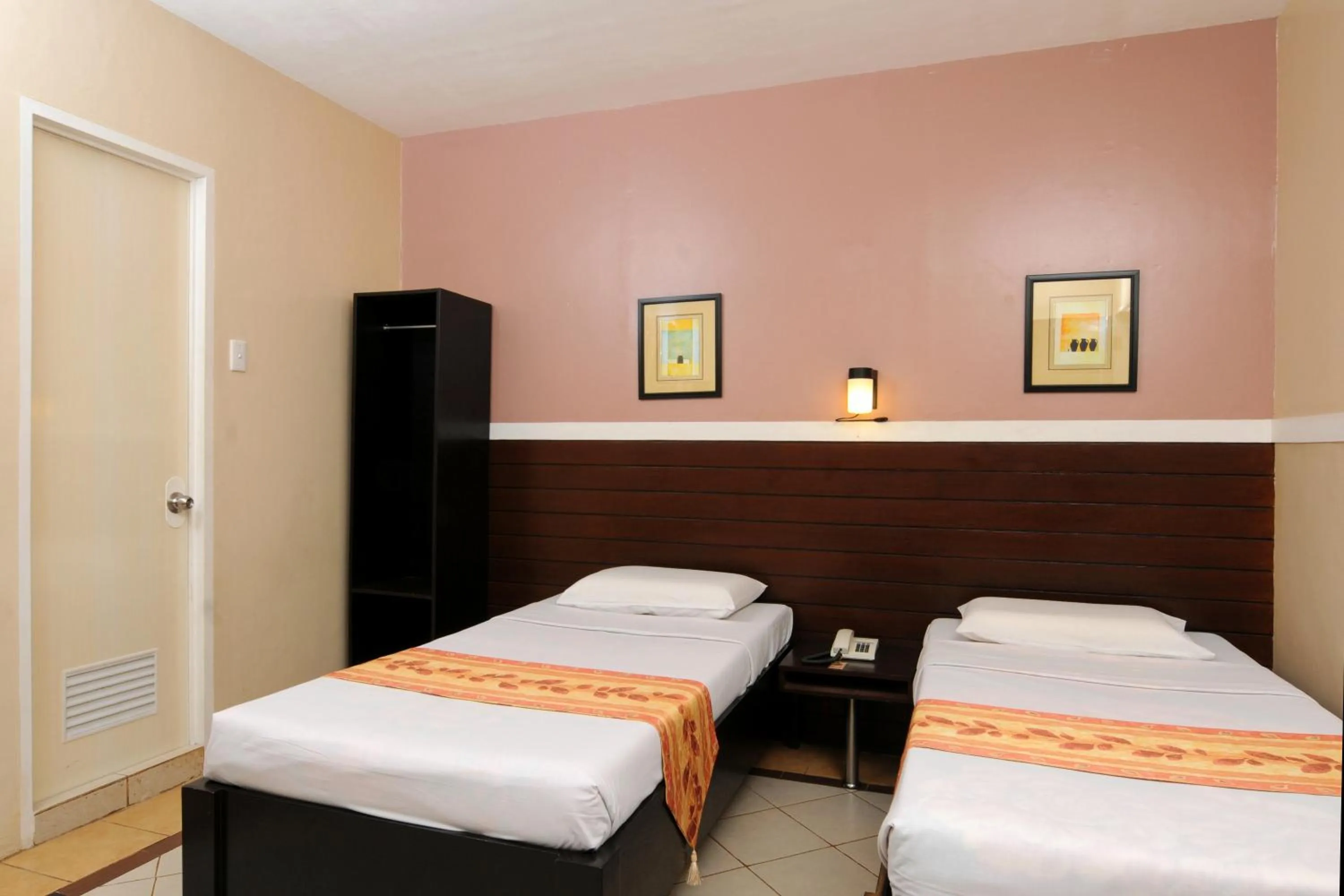 Bed in Sampaguita Suites JRG