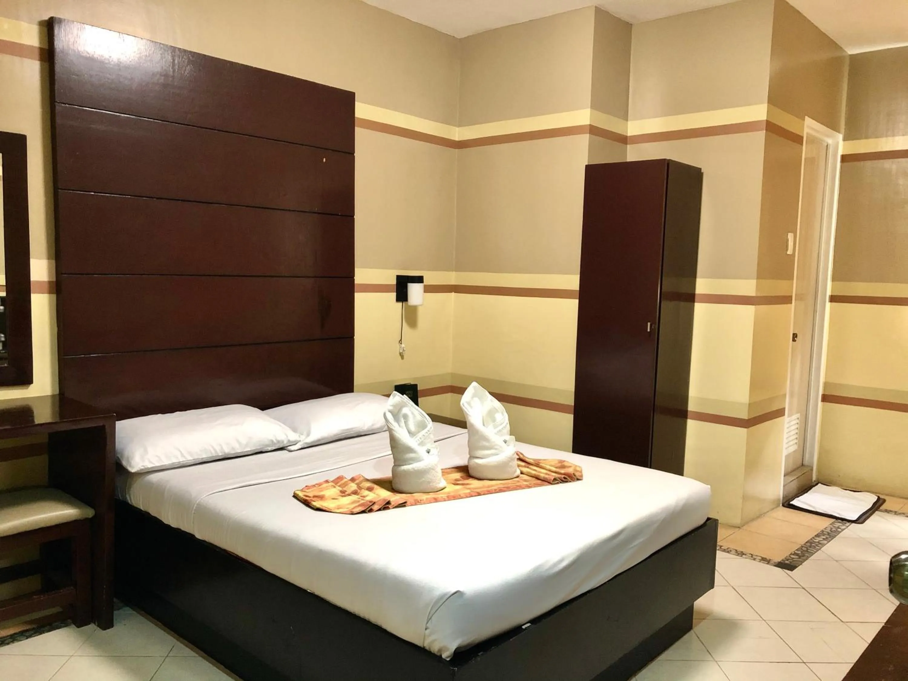 Bed in Sampaguita Suites JRG