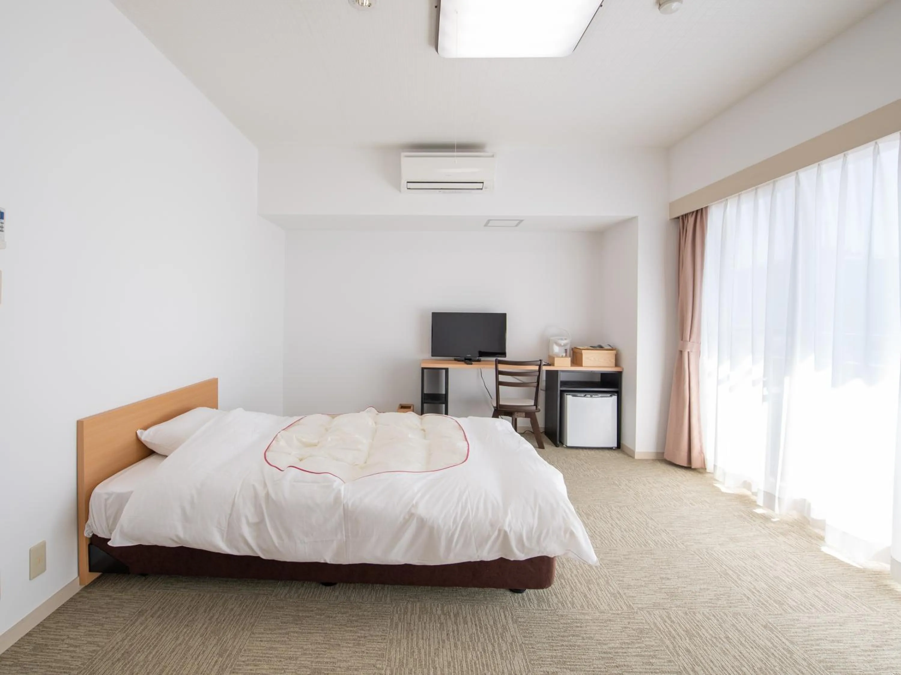 Bed in Chateraise Lodge Kasugai