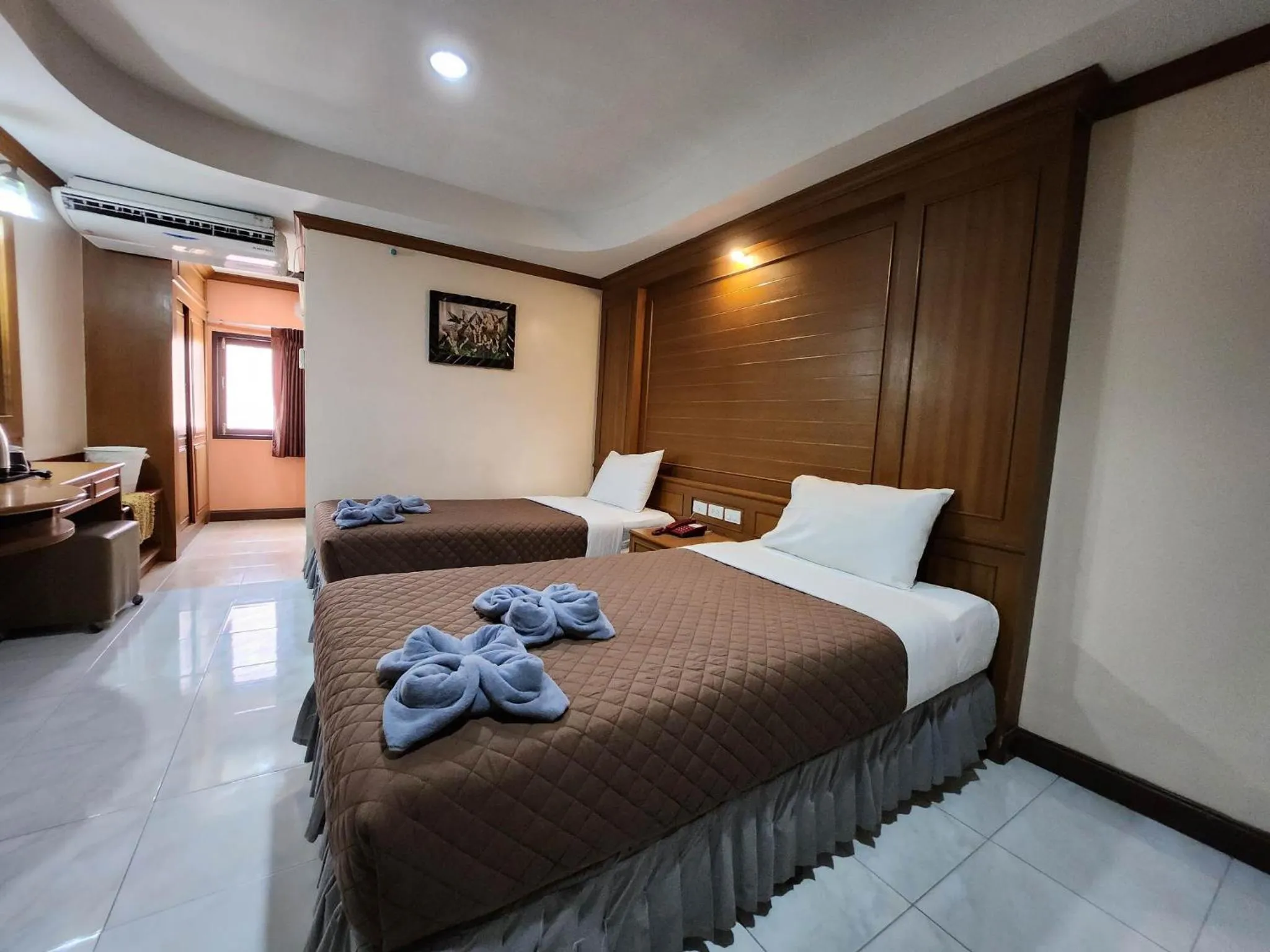 Bedroom in White Rose​ Hotel​ II​
