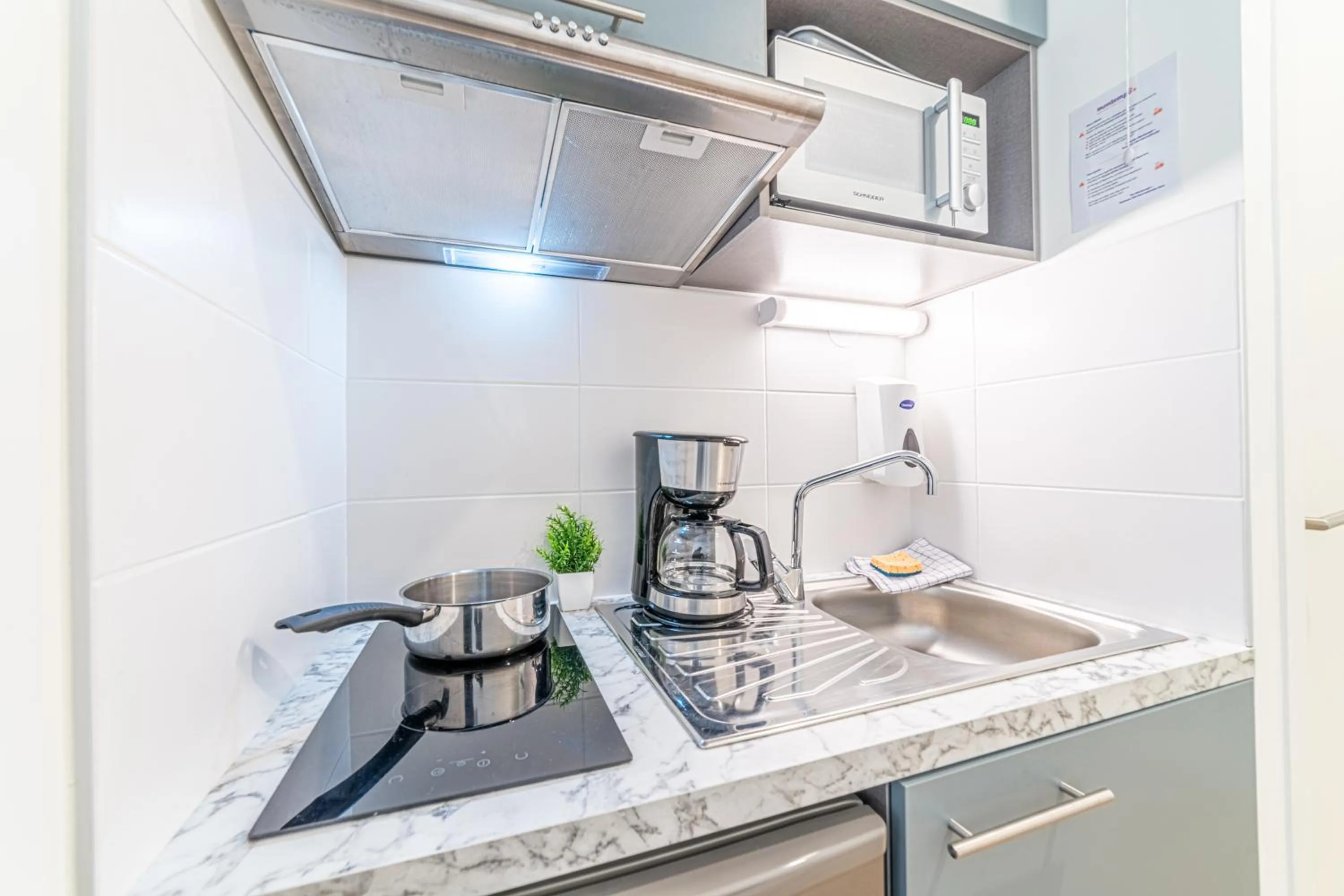 kitchen in Montempô Appart'Hôtel Toulouse Cité Internationale