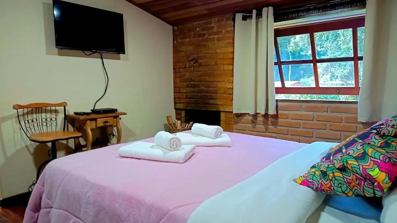 Bed in Pousada Bosque do Visconde