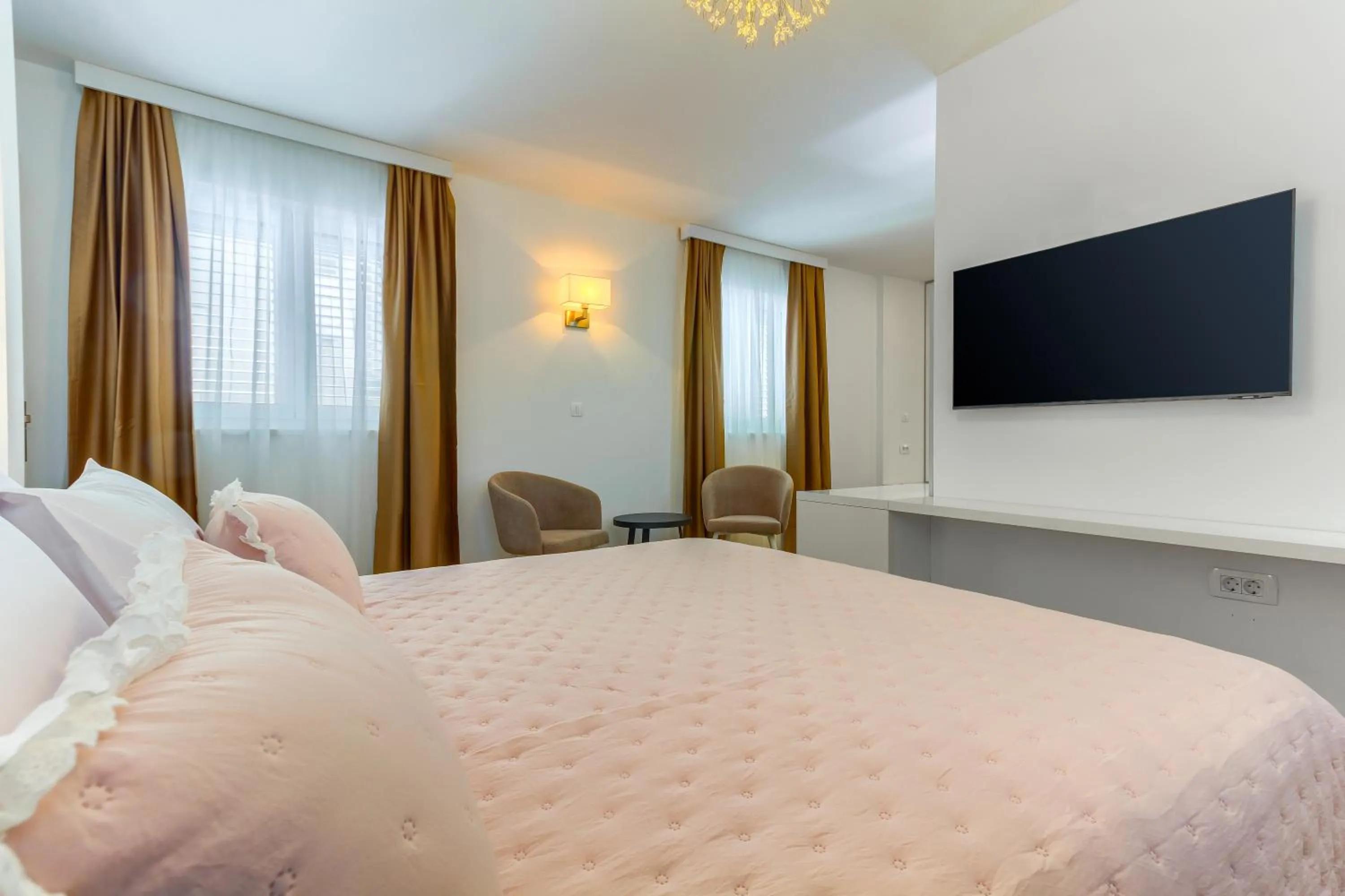 Bed in Irini Luxury Rooms