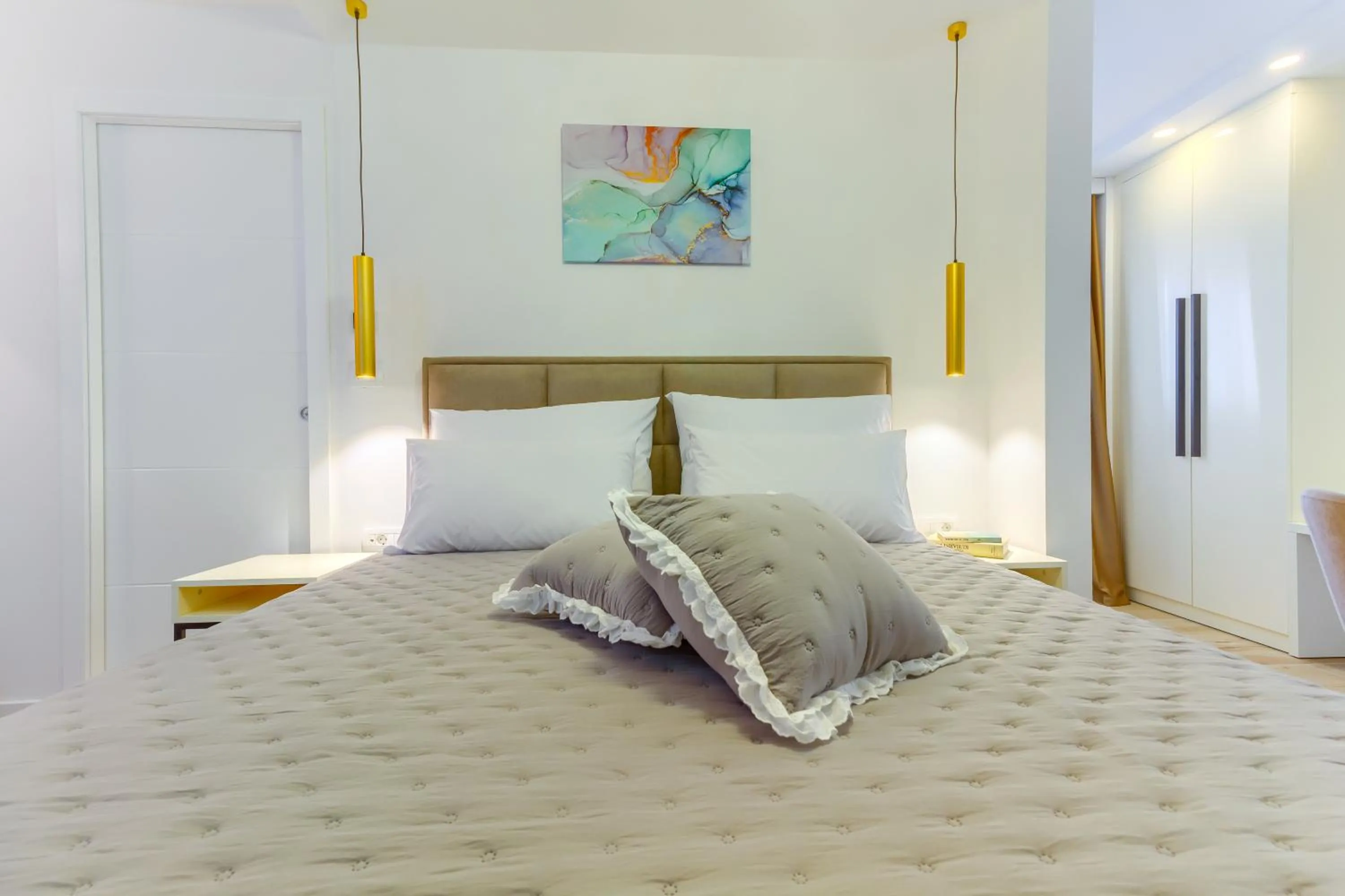 Bed in Irini Luxury Rooms