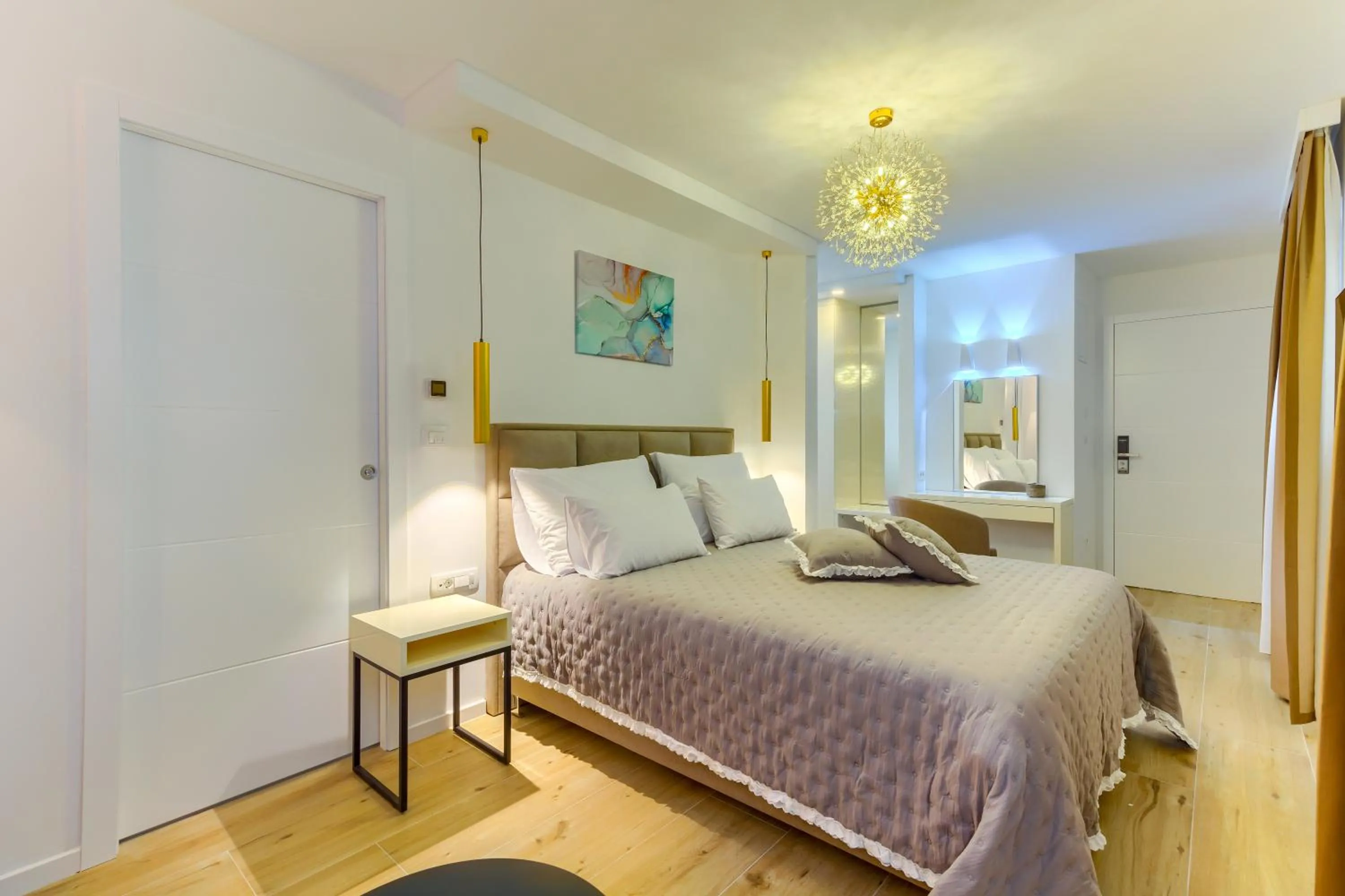 Bed in Irini Luxury Rooms