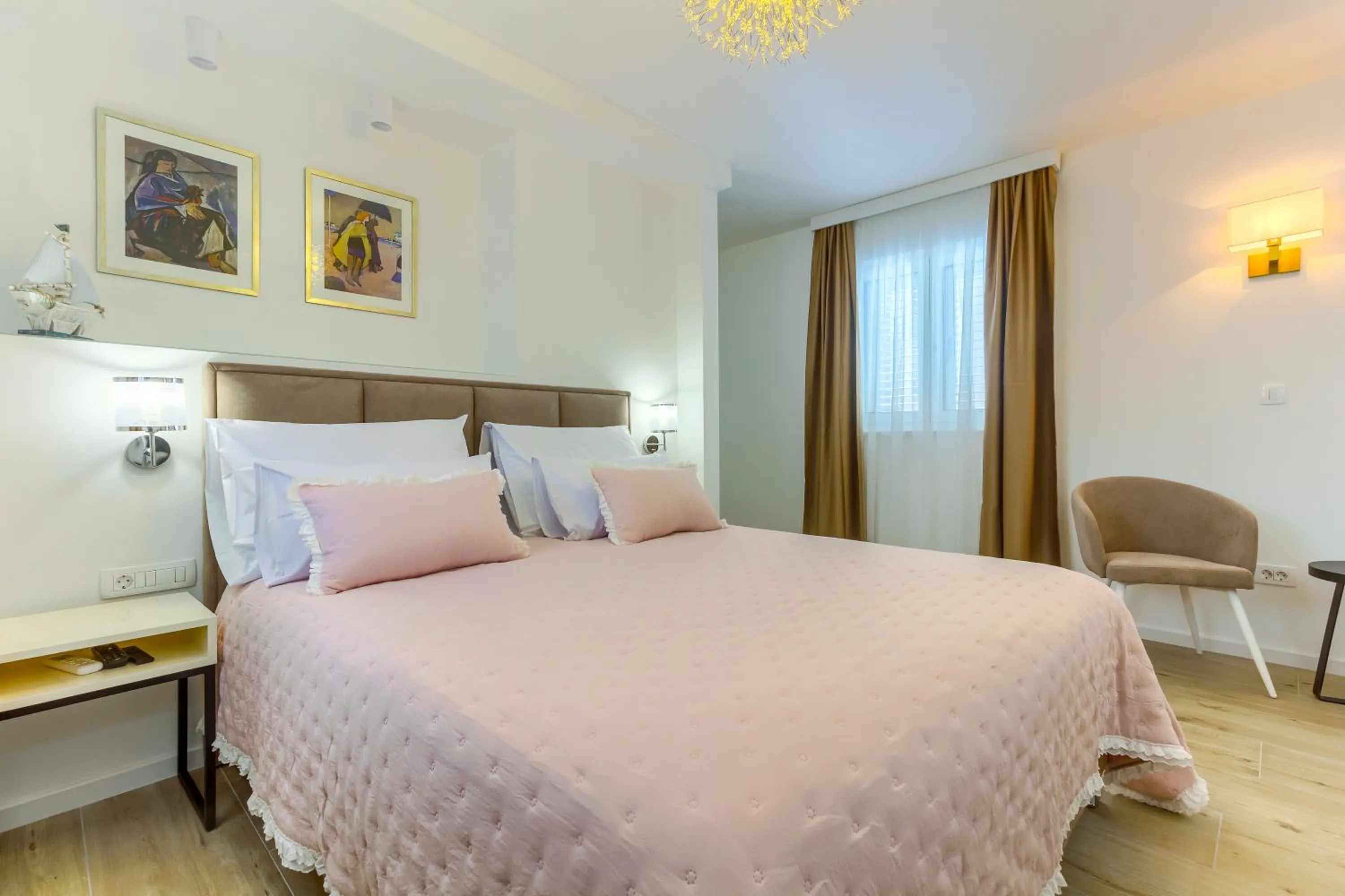 Bed in Irini Luxury Rooms