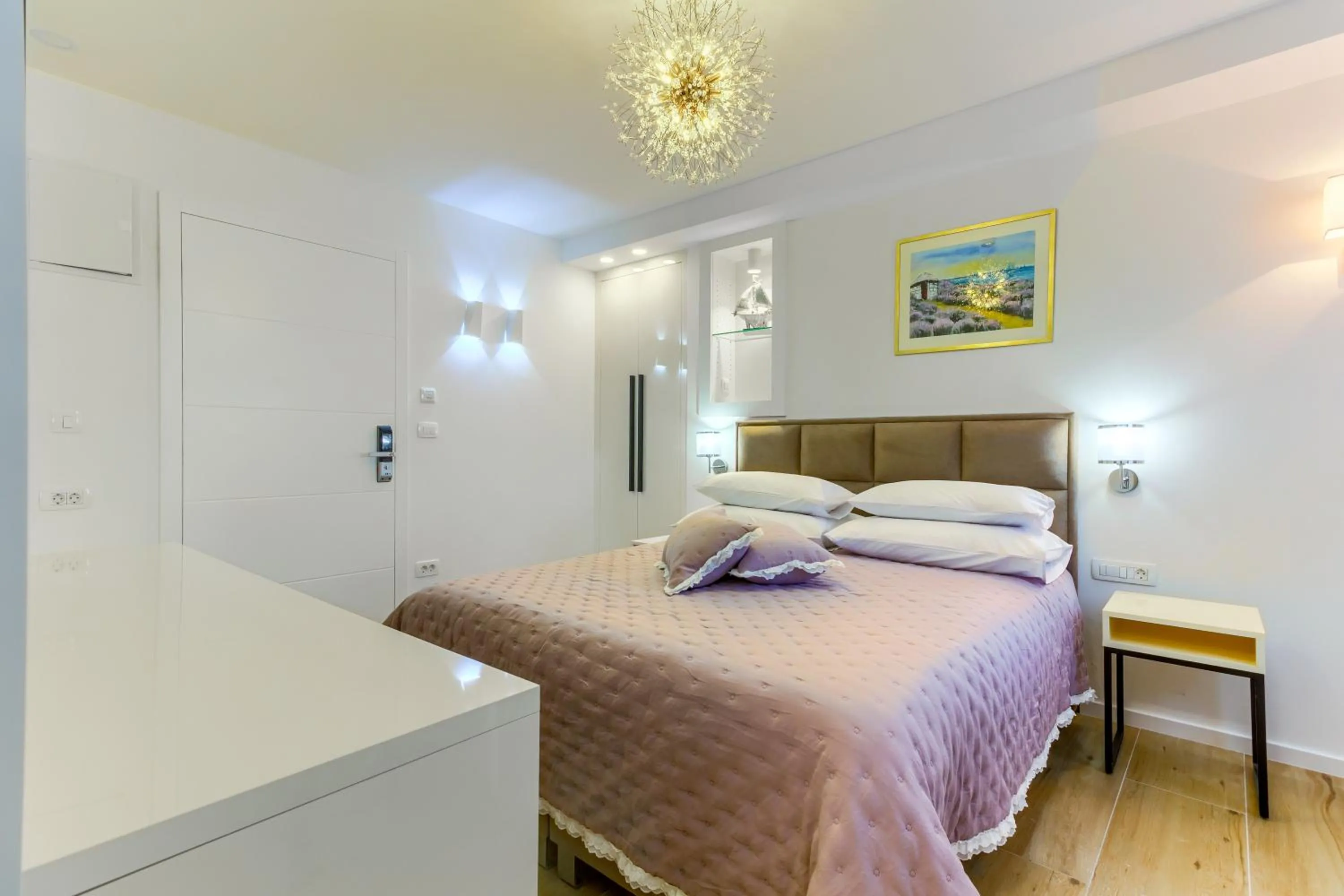 Bed in Irini Luxury Rooms