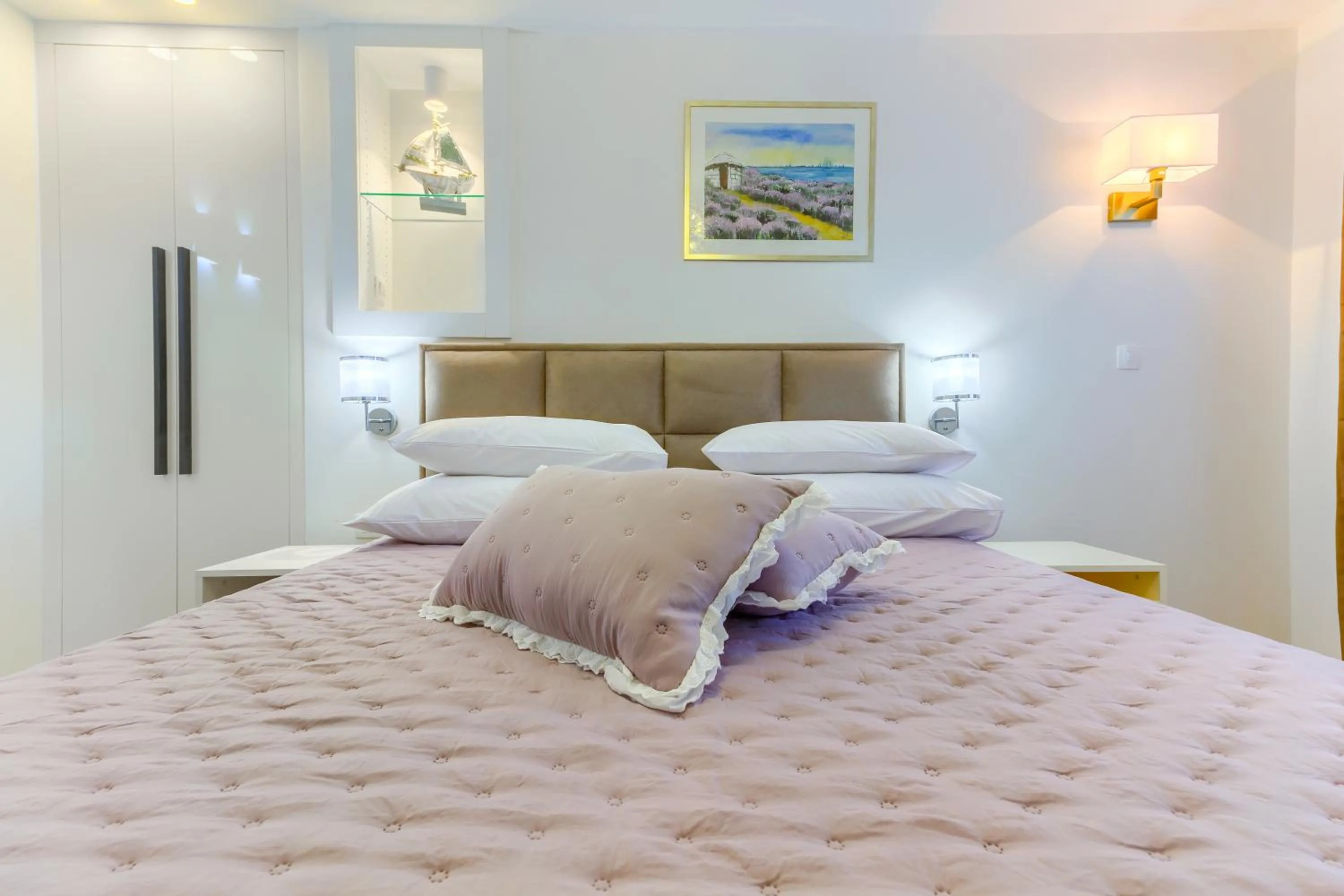 Bed in Irini Luxury Rooms