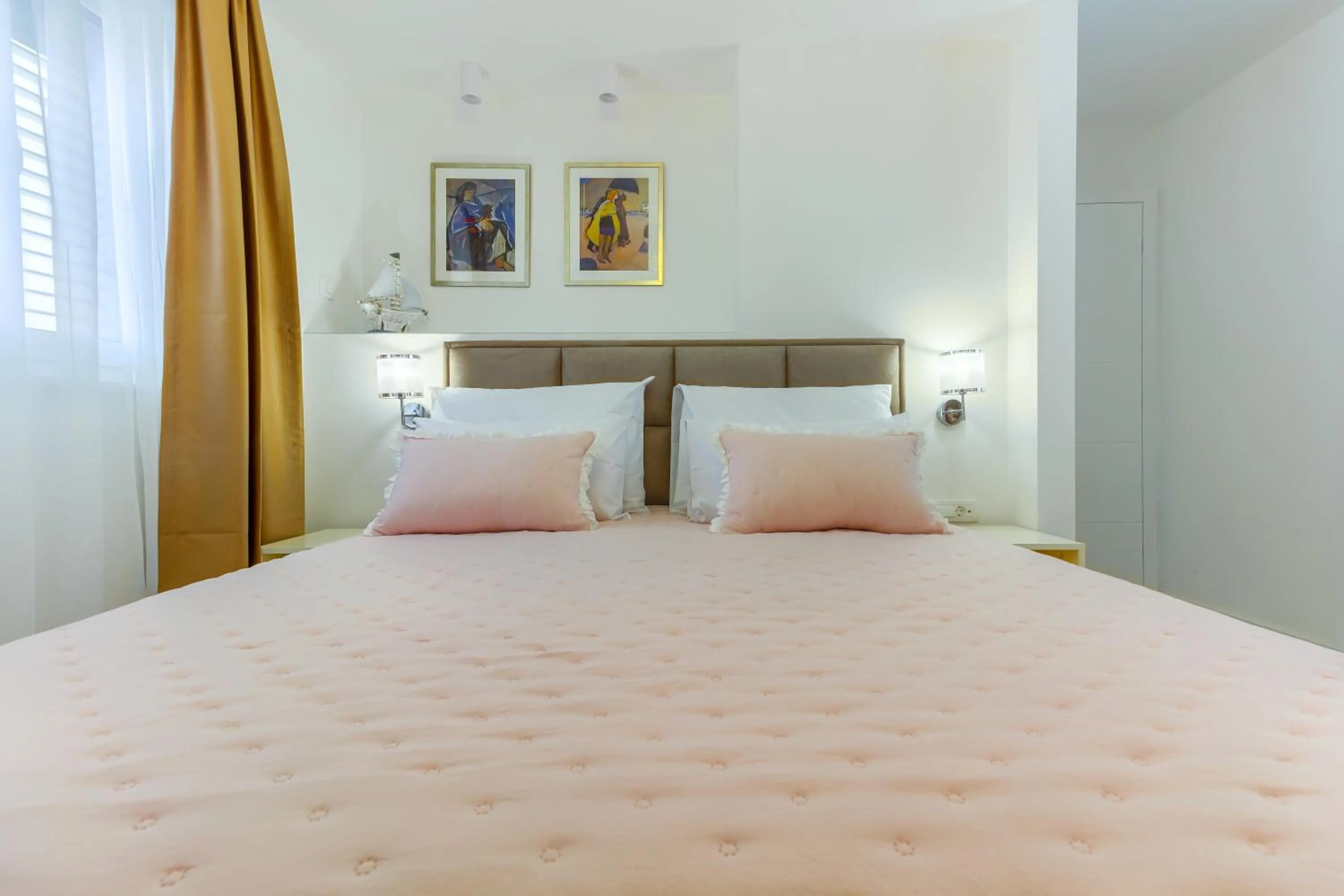 Bed in Irini Luxury Rooms