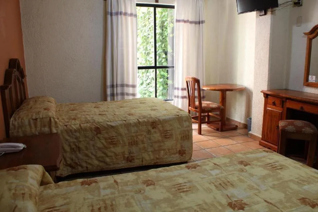 Bed in Hotel Oaxaca Dorado