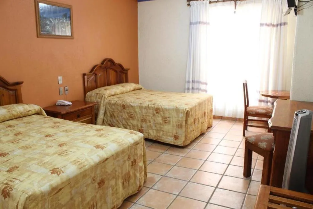 Bed in Hotel Oaxaca Dorado