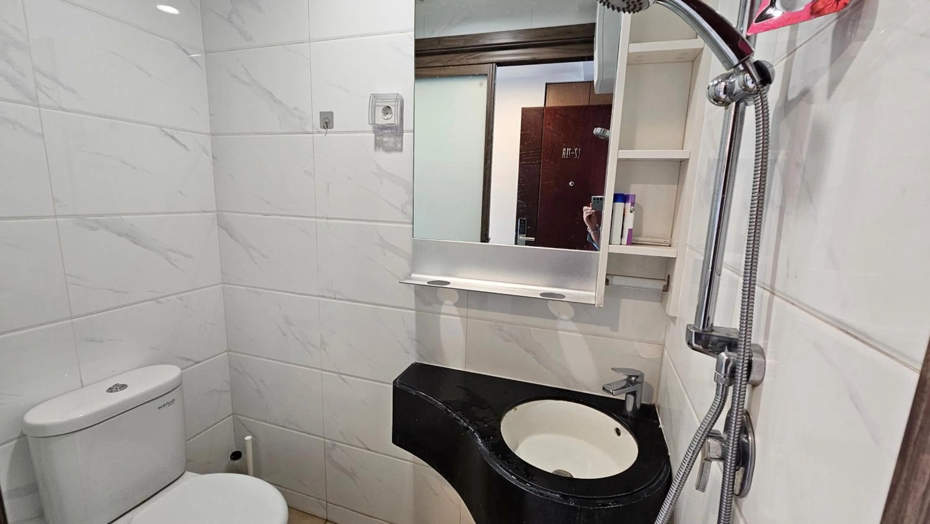 Bathroom in Apartement Sky House BSD TL19D By LiviRooms