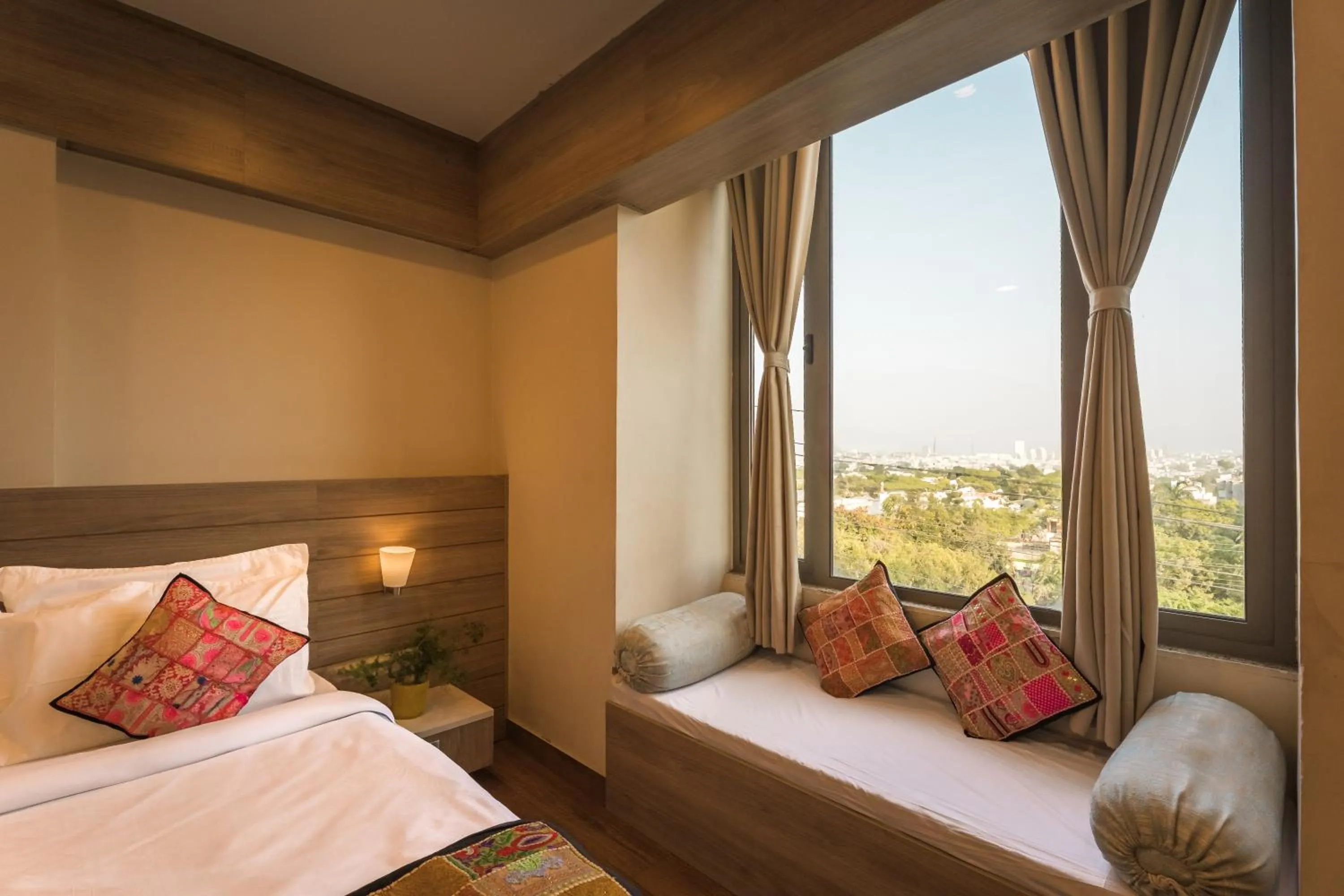 Bed in Tripli Hotels WonderCliff
