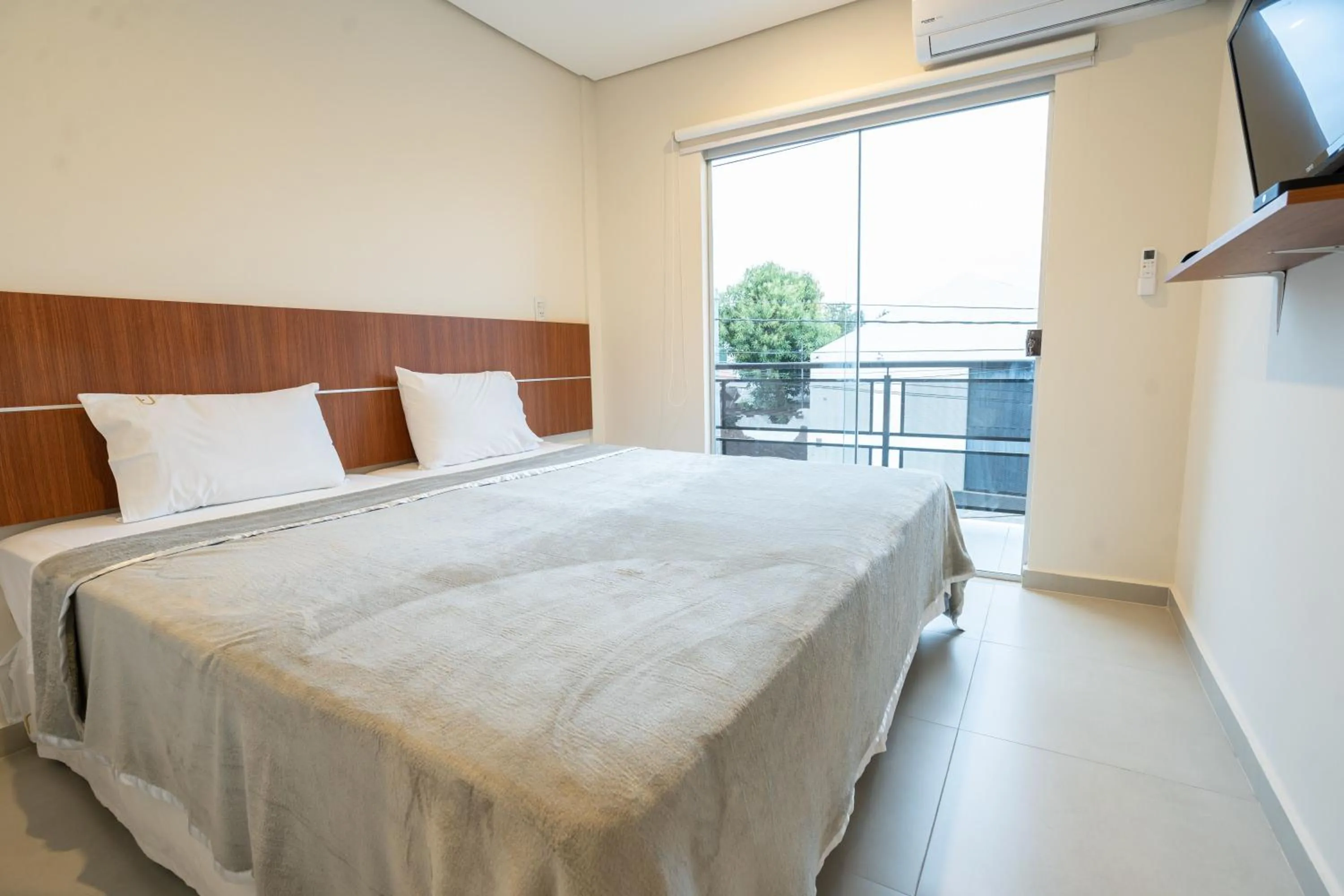 Bed in VIVARIUM APART HOTEL