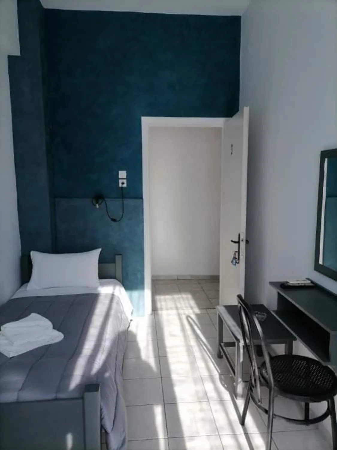 Bed in Hotel Theoxenia