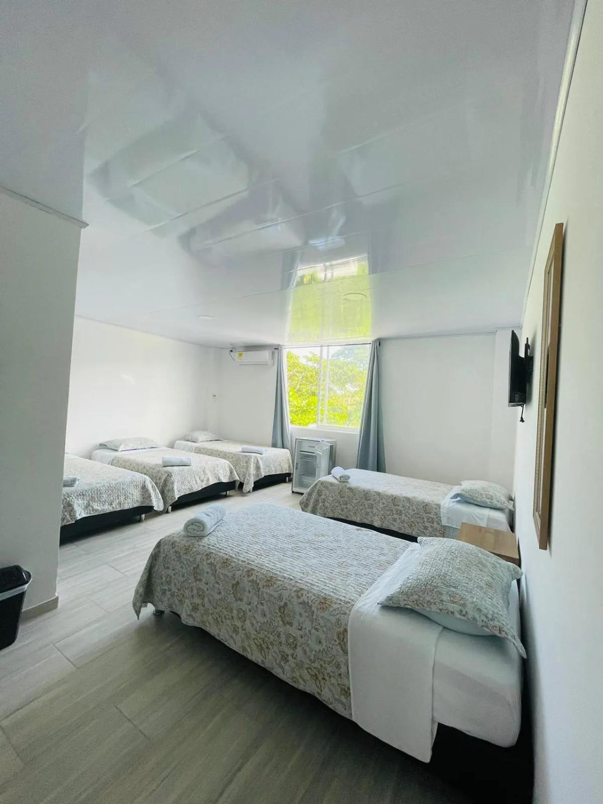 Bed in BLUE ISLAND HOTEL
