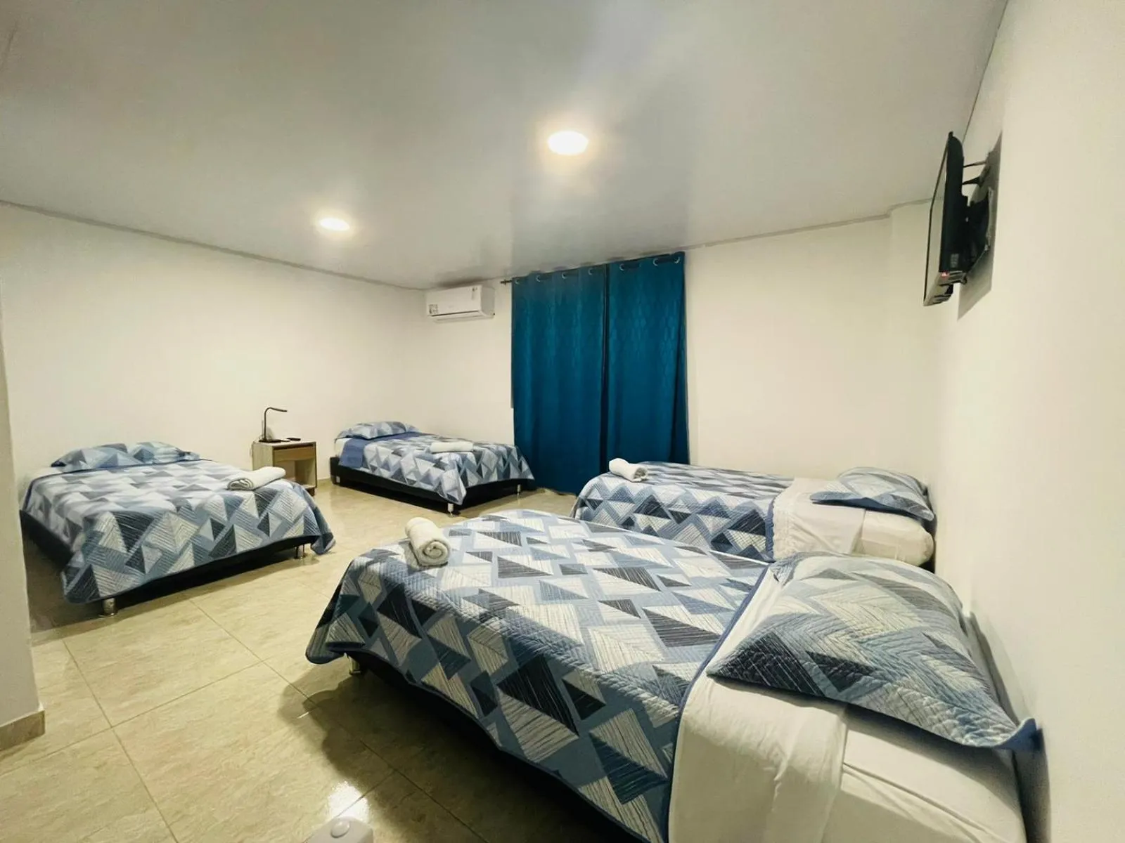 Bed in BLUE ISLAND HOTEL