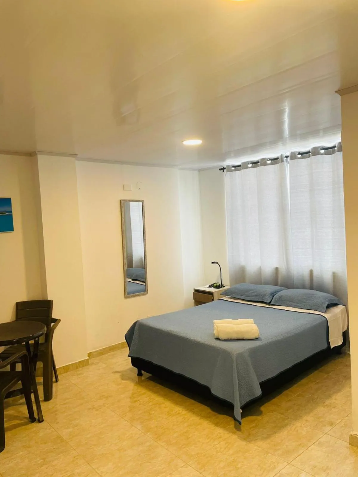Bed in BLUE ISLAND HOTEL