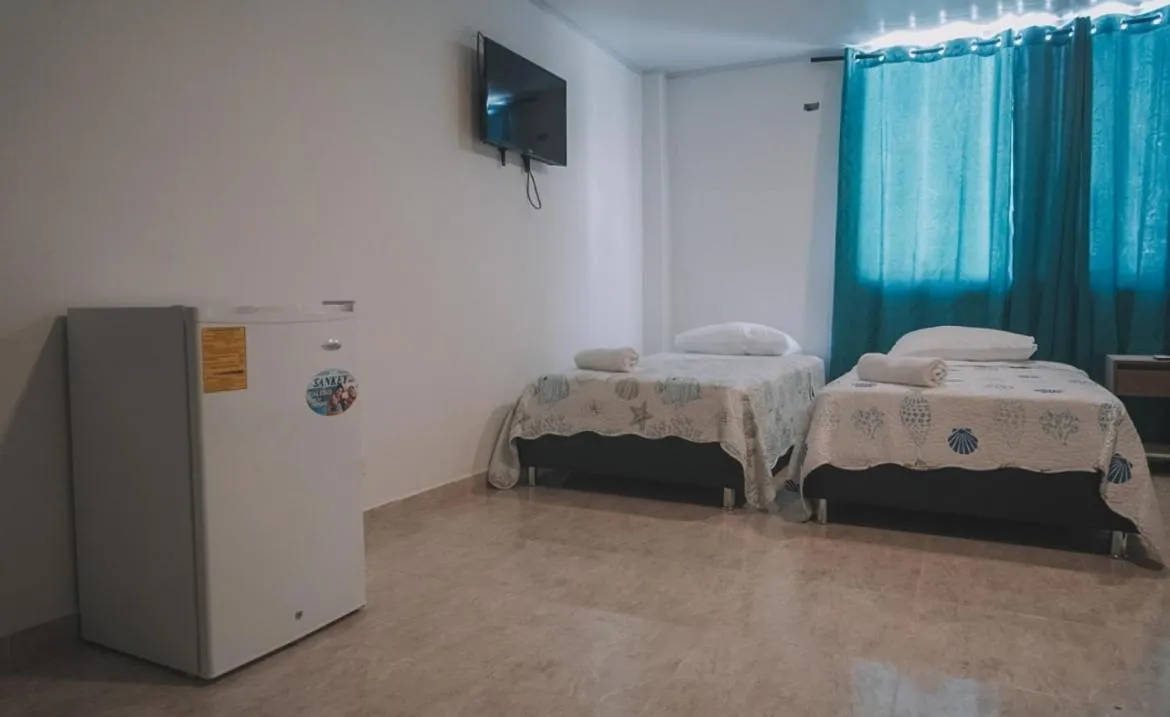 Bed in BLUE ISLAND HOTEL