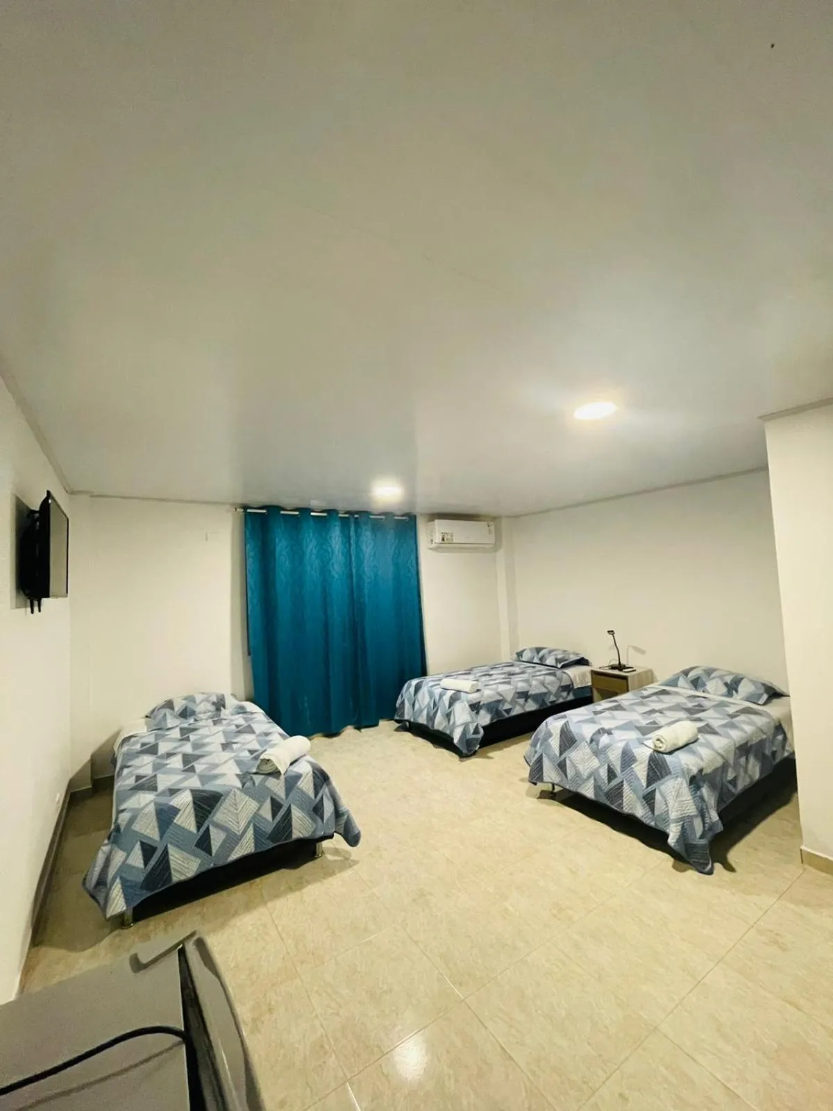 Bed in BLUE ISLAND HOTEL