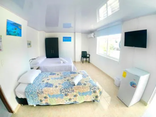 Bed in BLUE ISLAND HOTEL