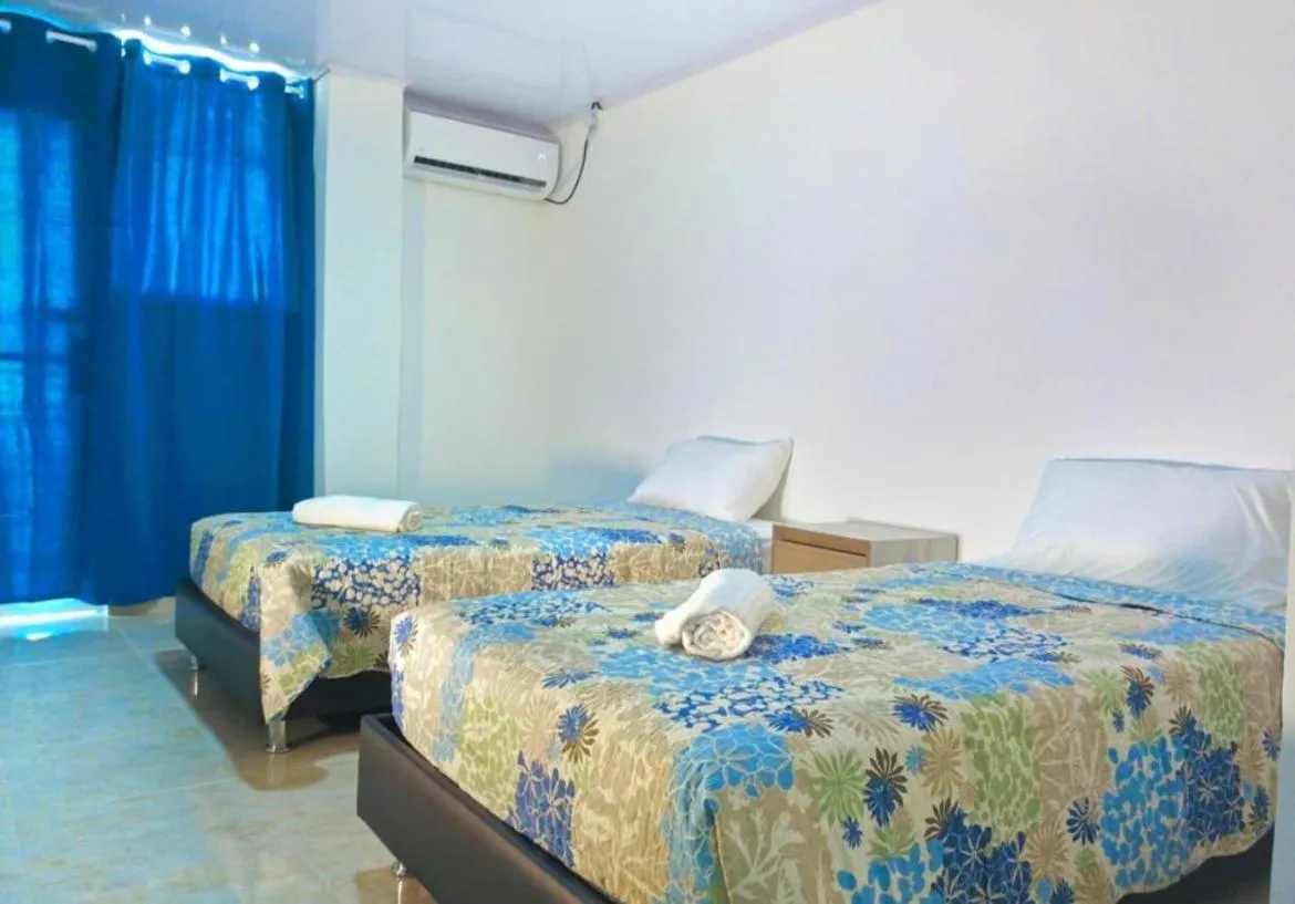 Bed in BLUE ISLAND HOTEL